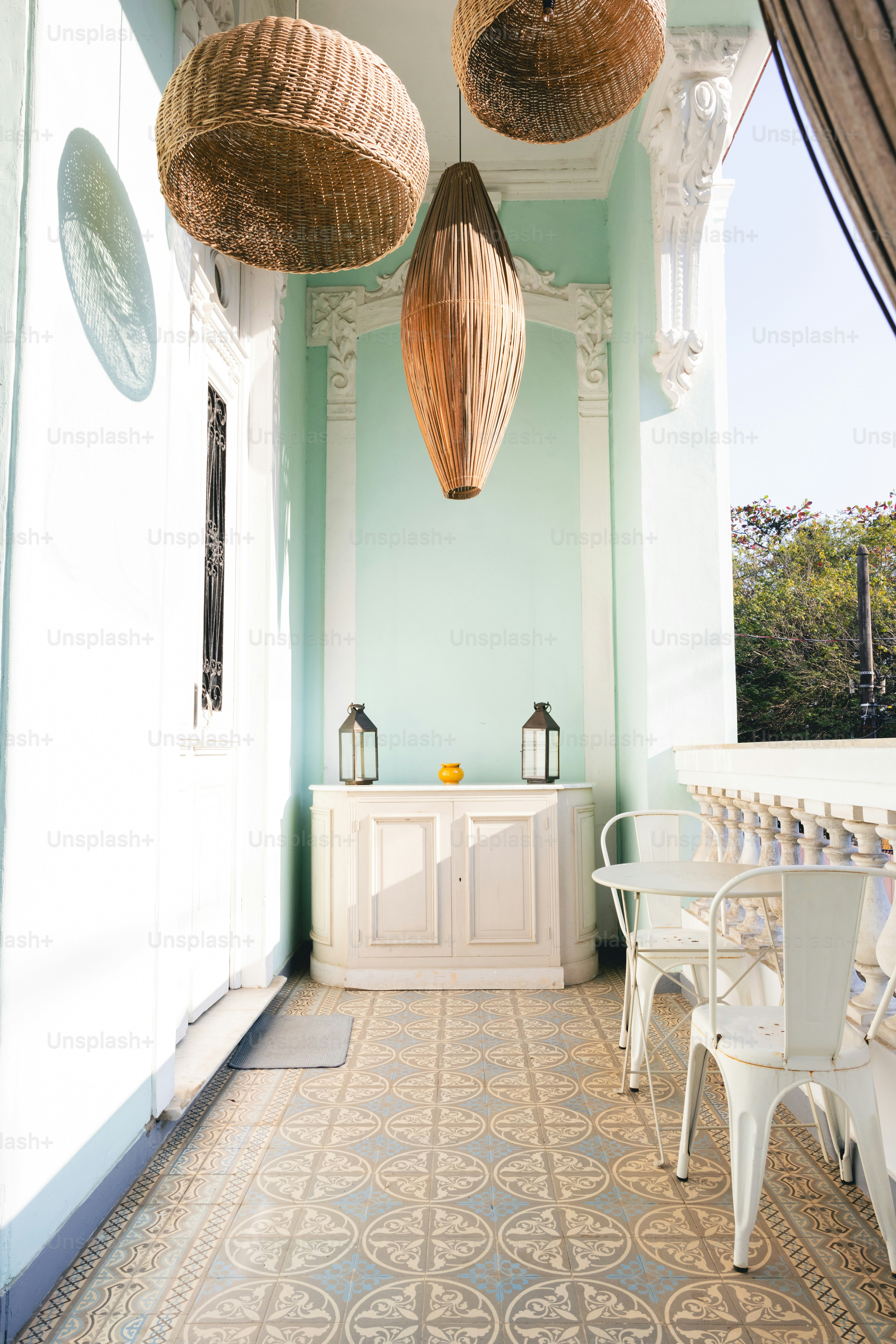 A room with a lot of wicker baskets hanging from the ceiling