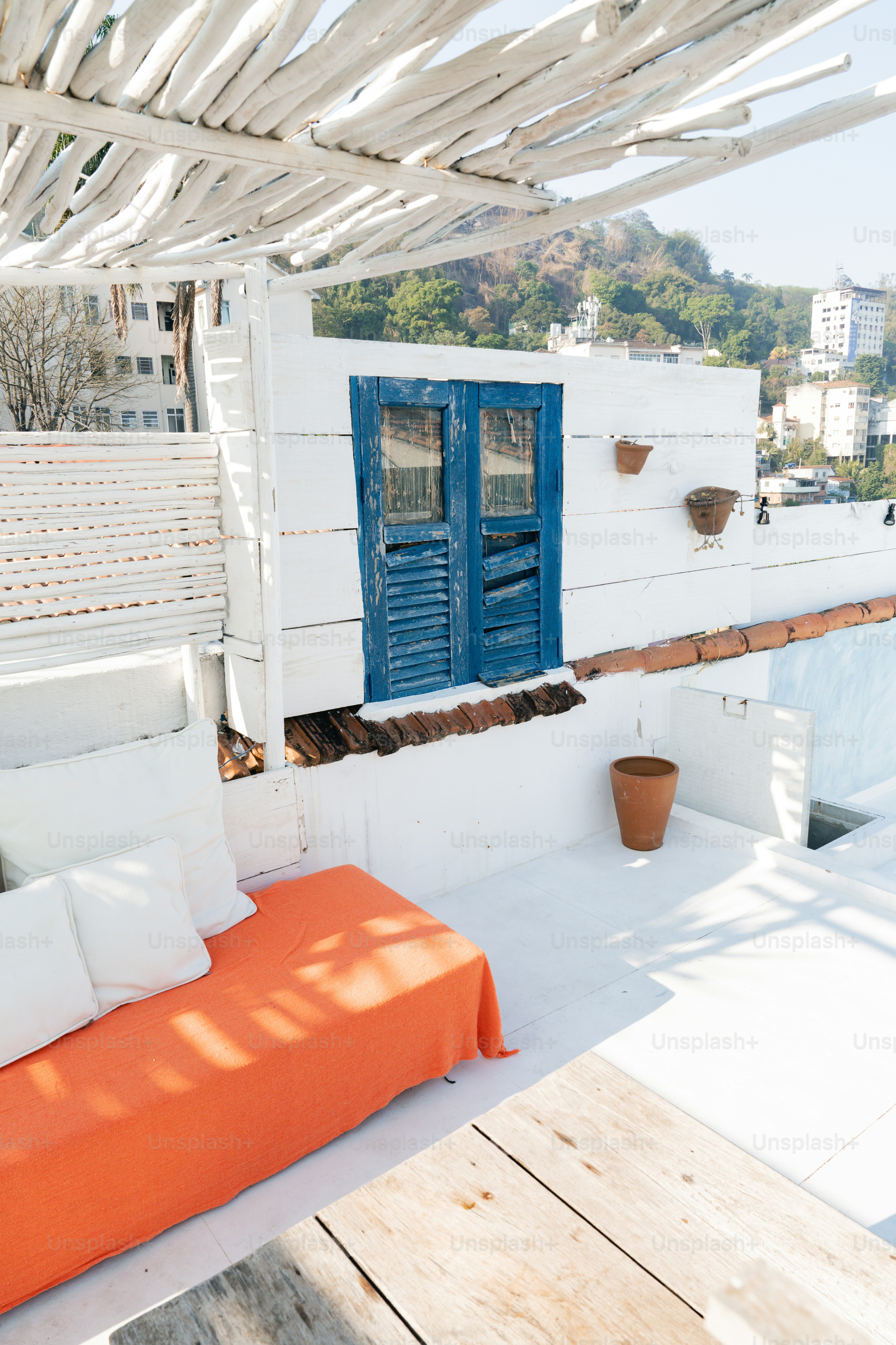 A couch sitting on top of a white roof