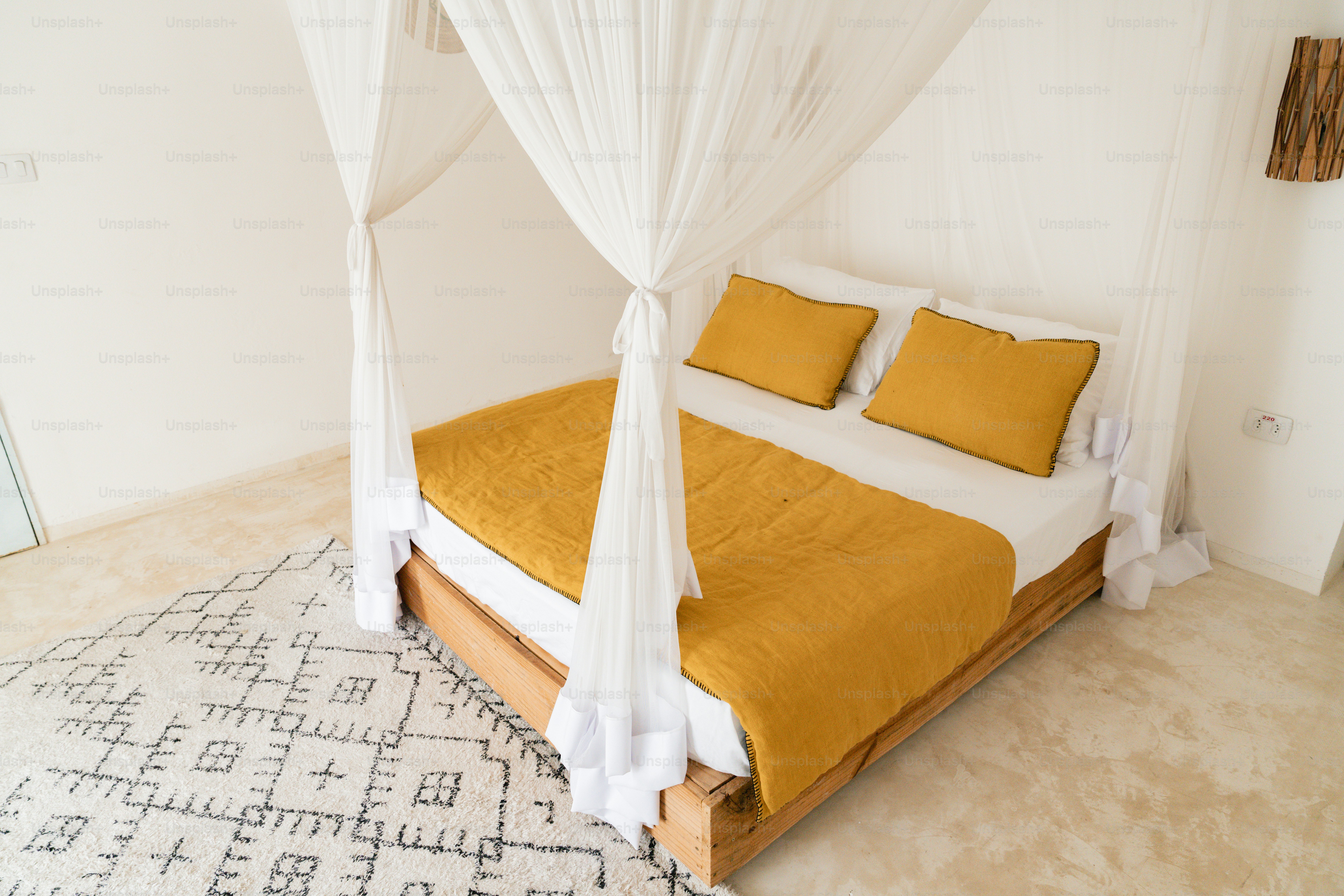 A bed with a white canopy over it