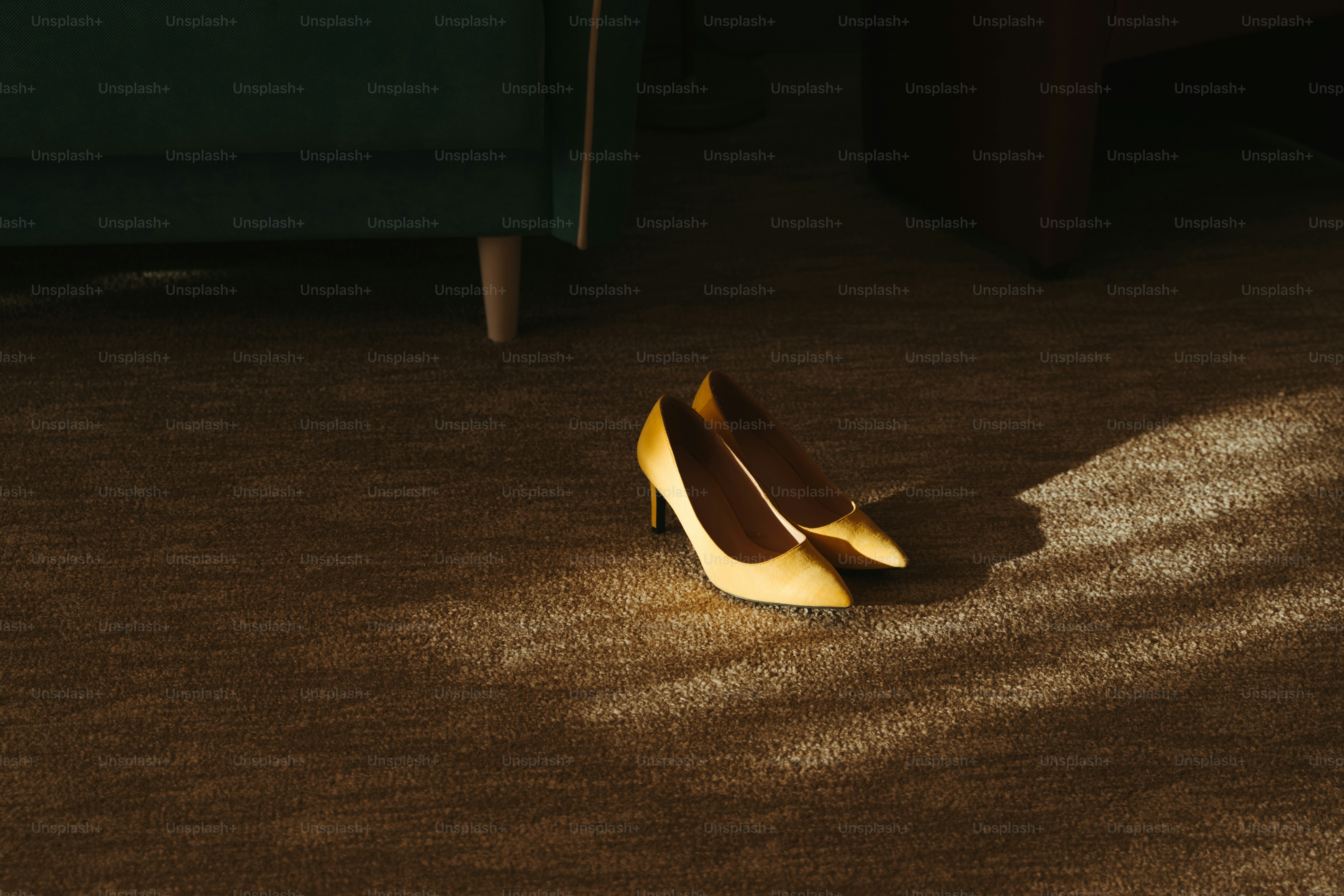 A pair of shoes sitting on the floor of a living room