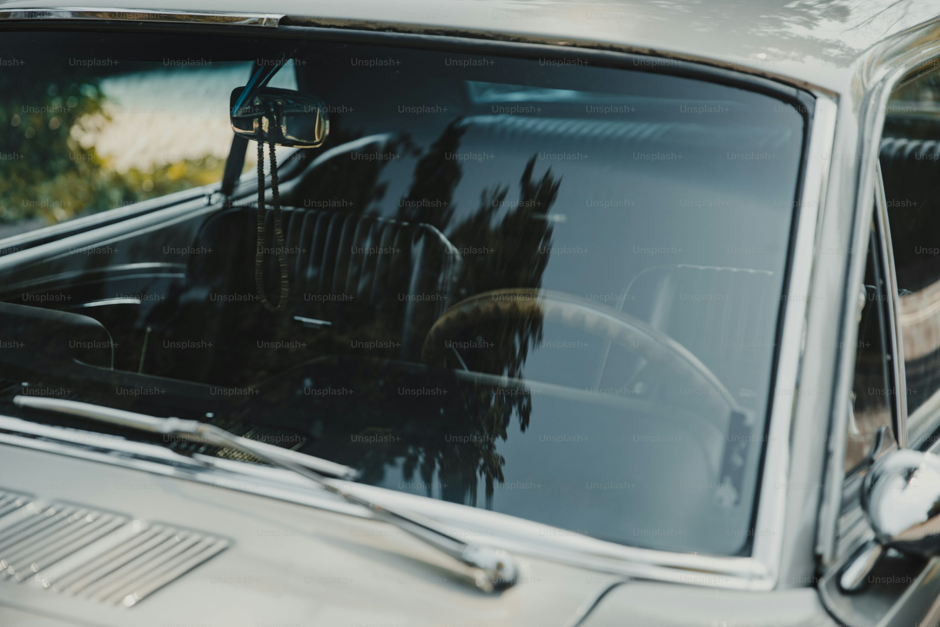 The reflection of a car in the windshield