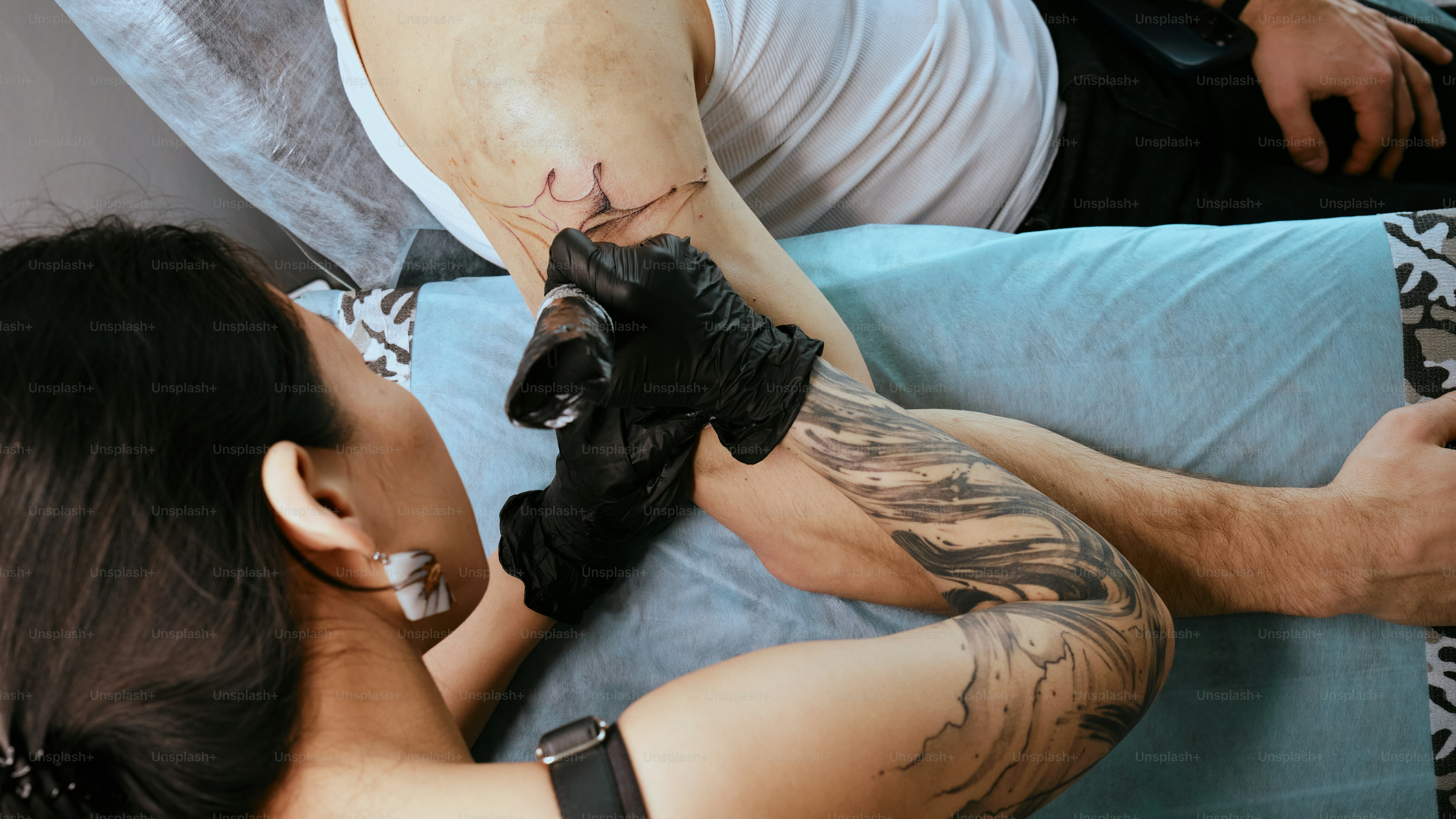 A couple of people laying on top of a bed