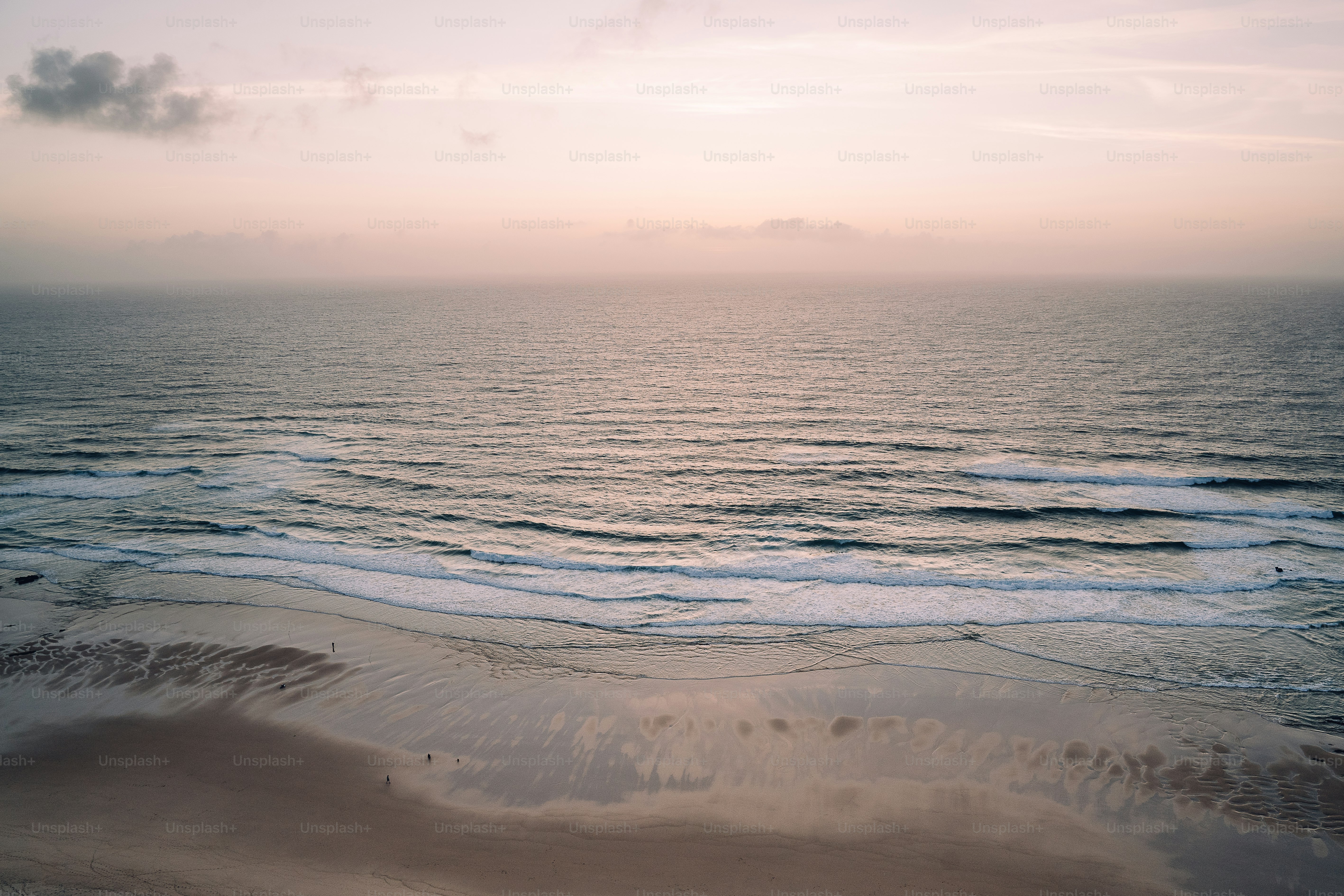 A blurry photo of a beach at sunset