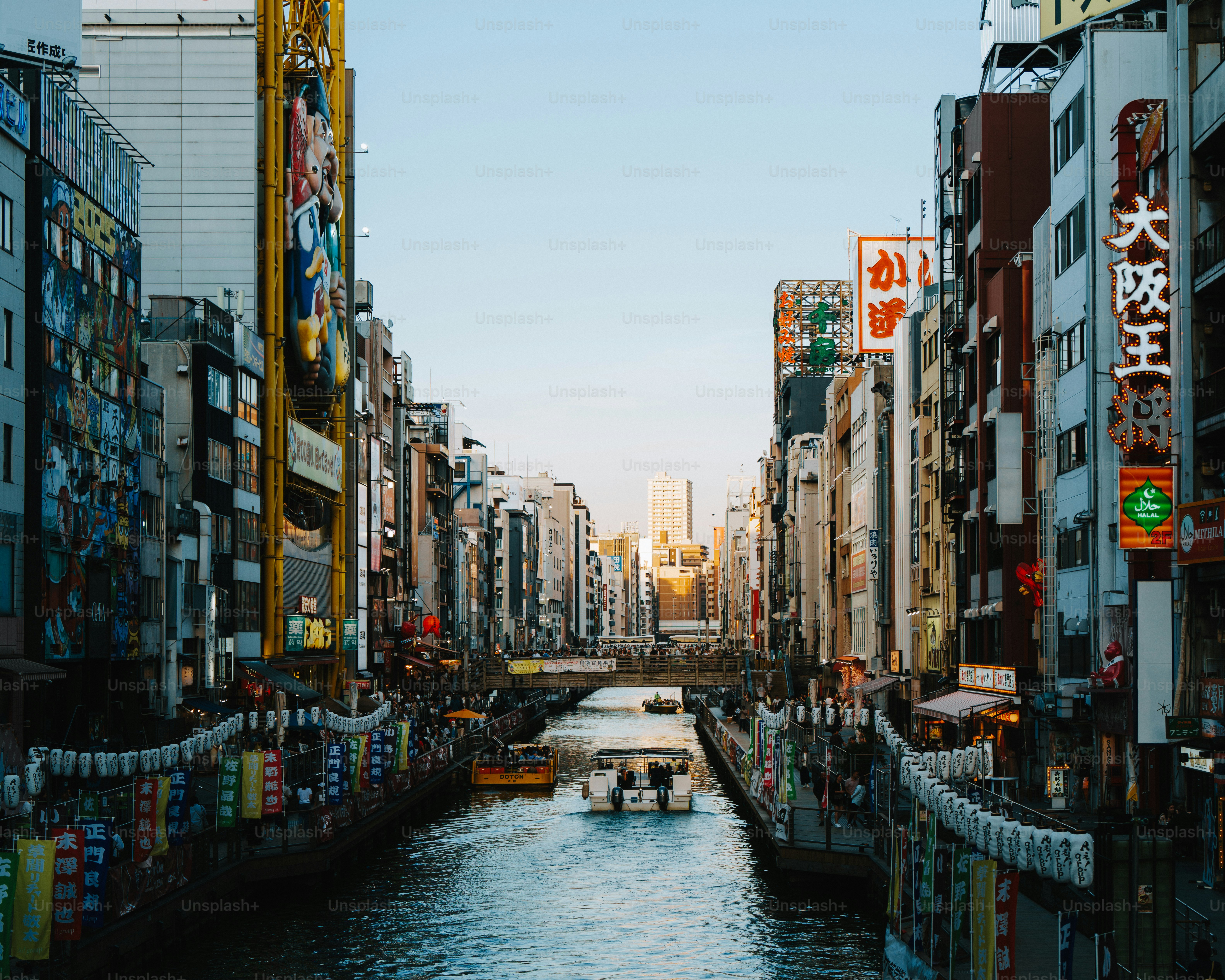 A river running through a city next to tall buildings