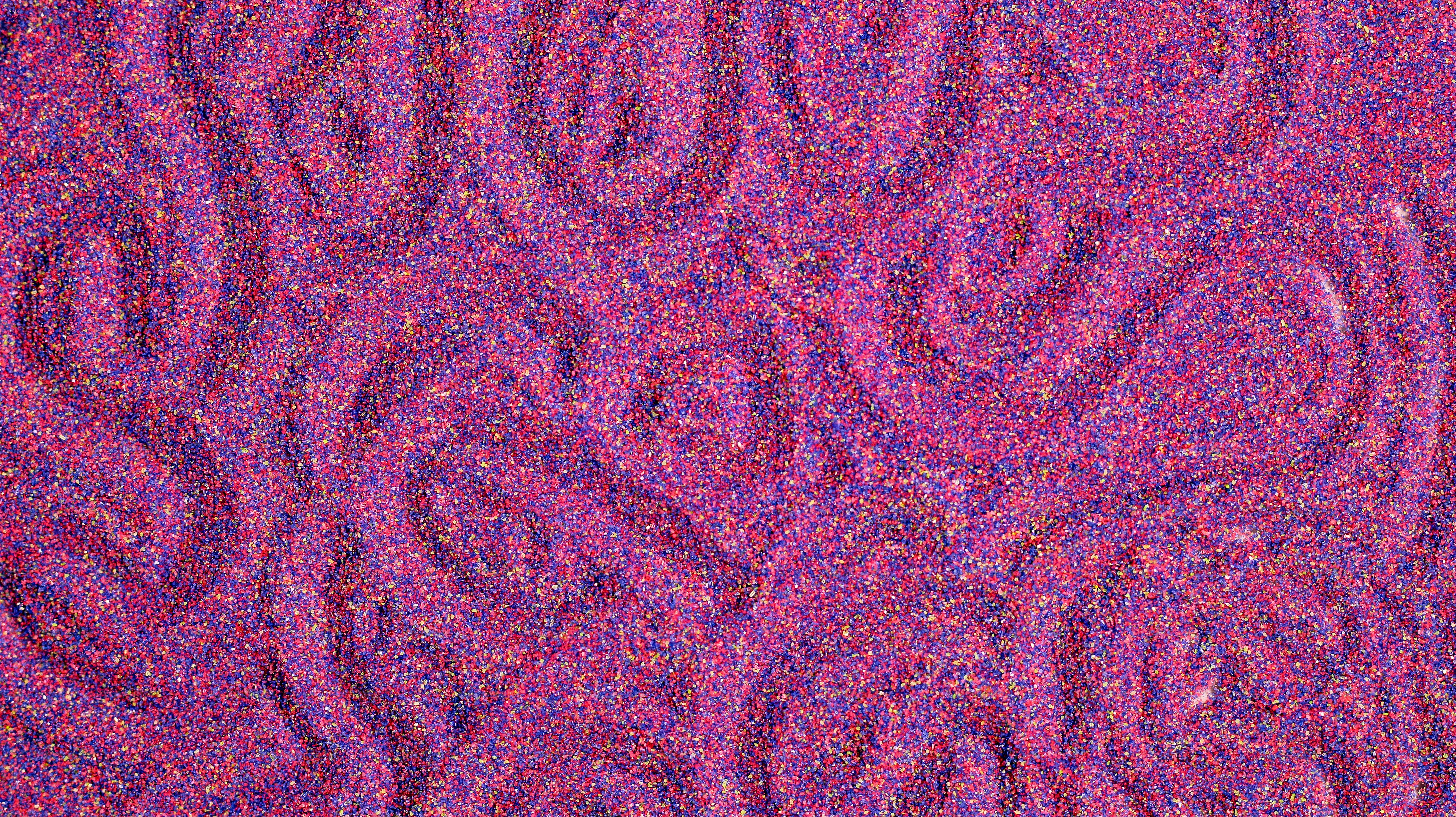 A close up of a purple surface with small dots