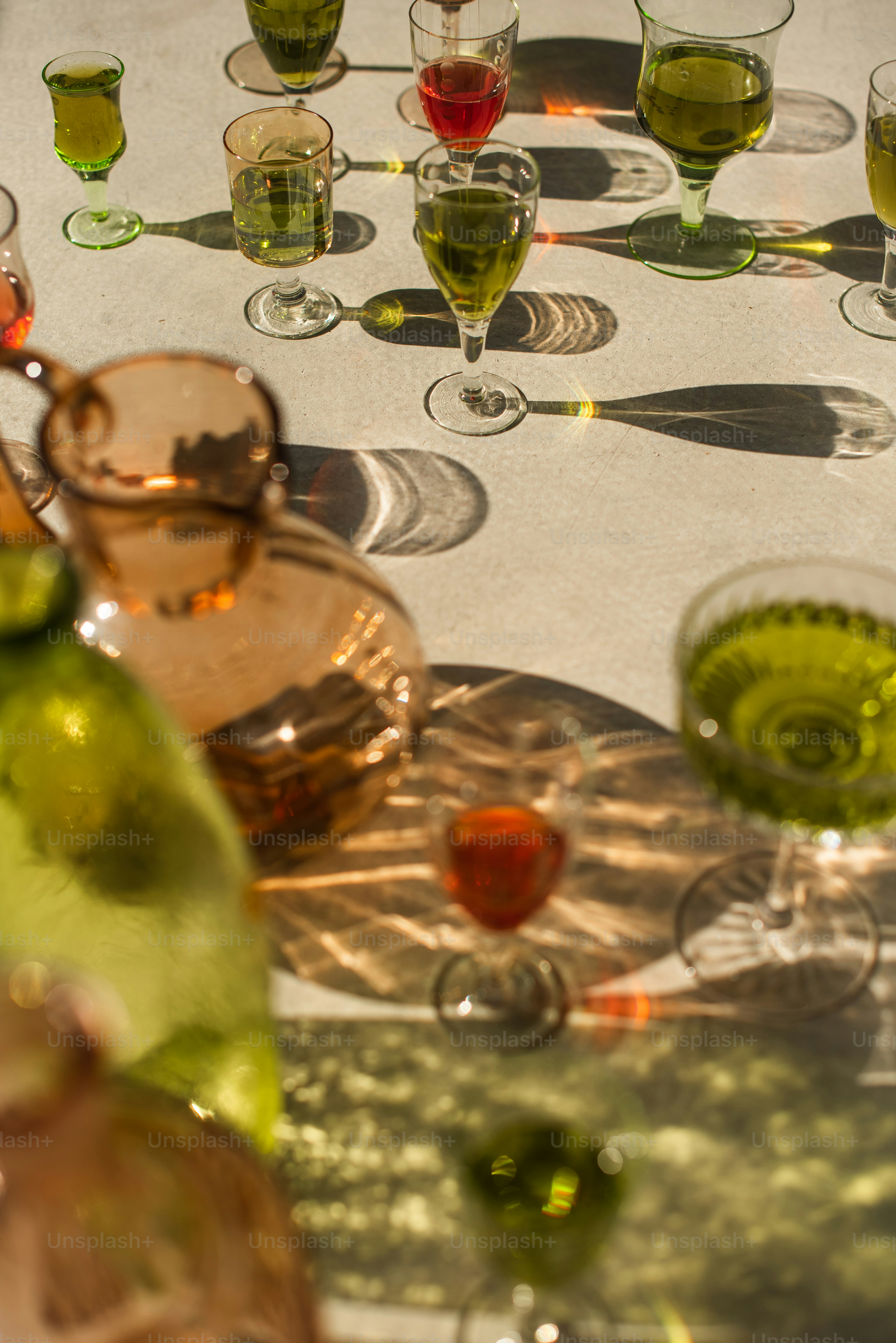 A table topped with lots of wine glasses