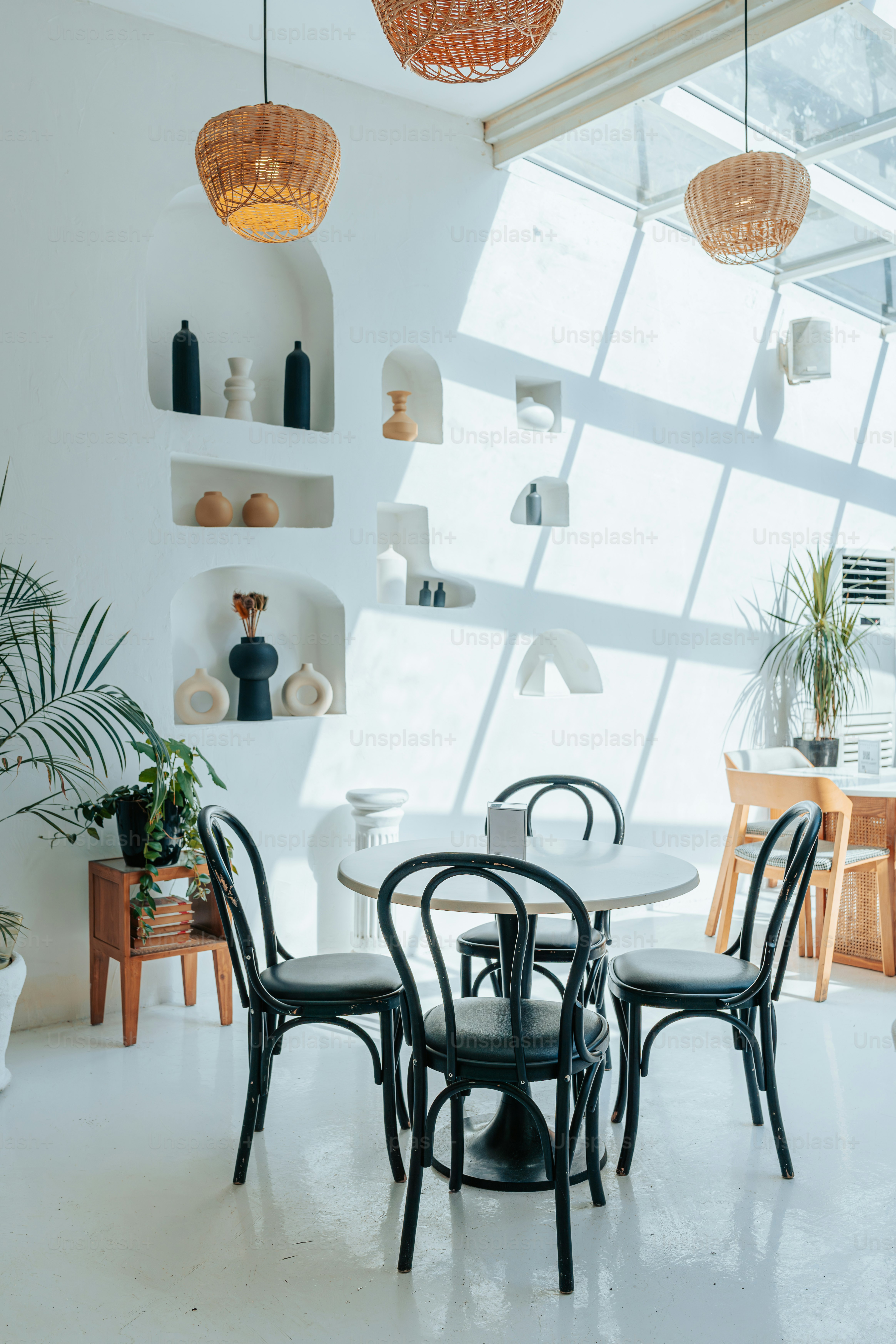 A dining room with a table and chairs