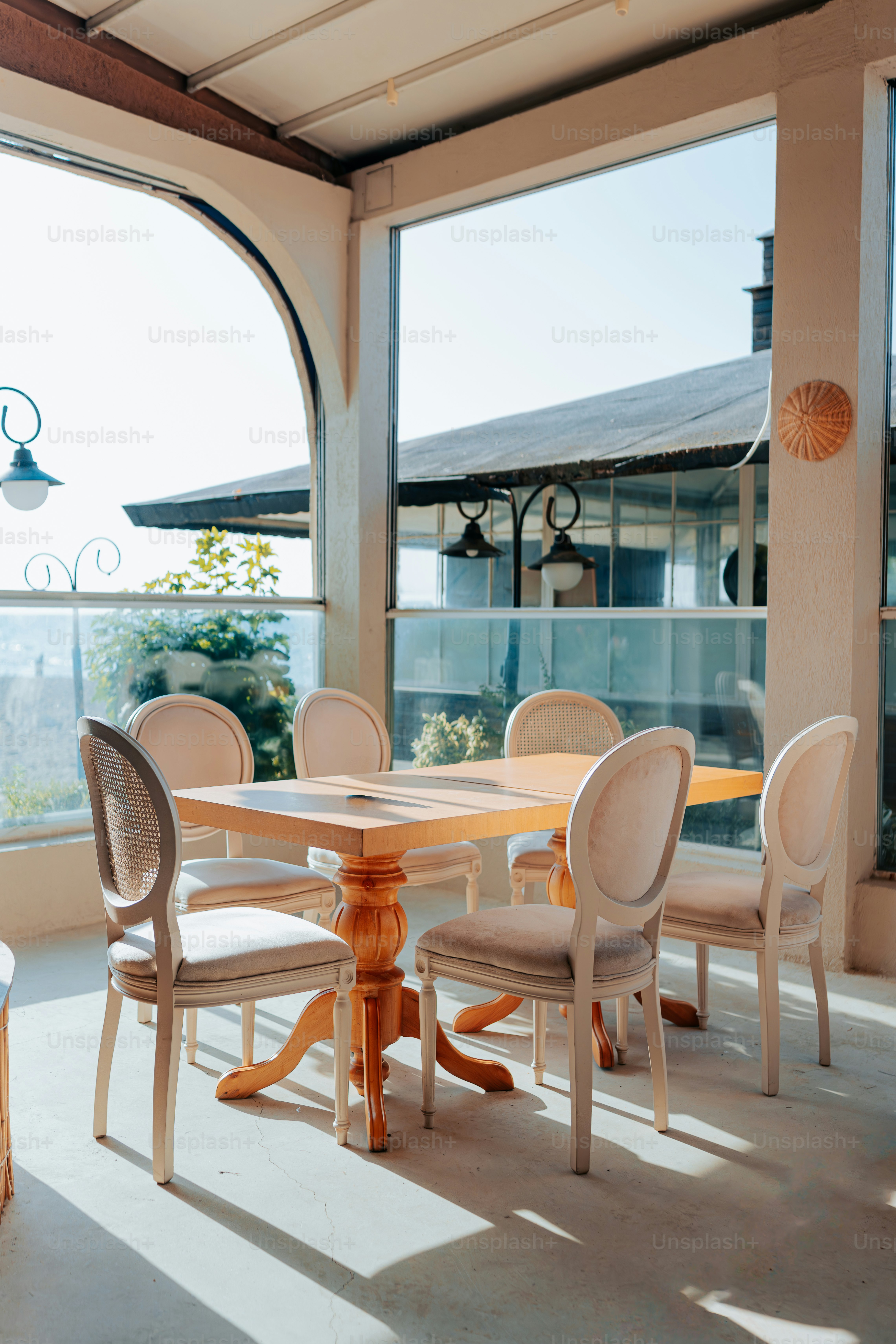 A dining room with a table and chairs