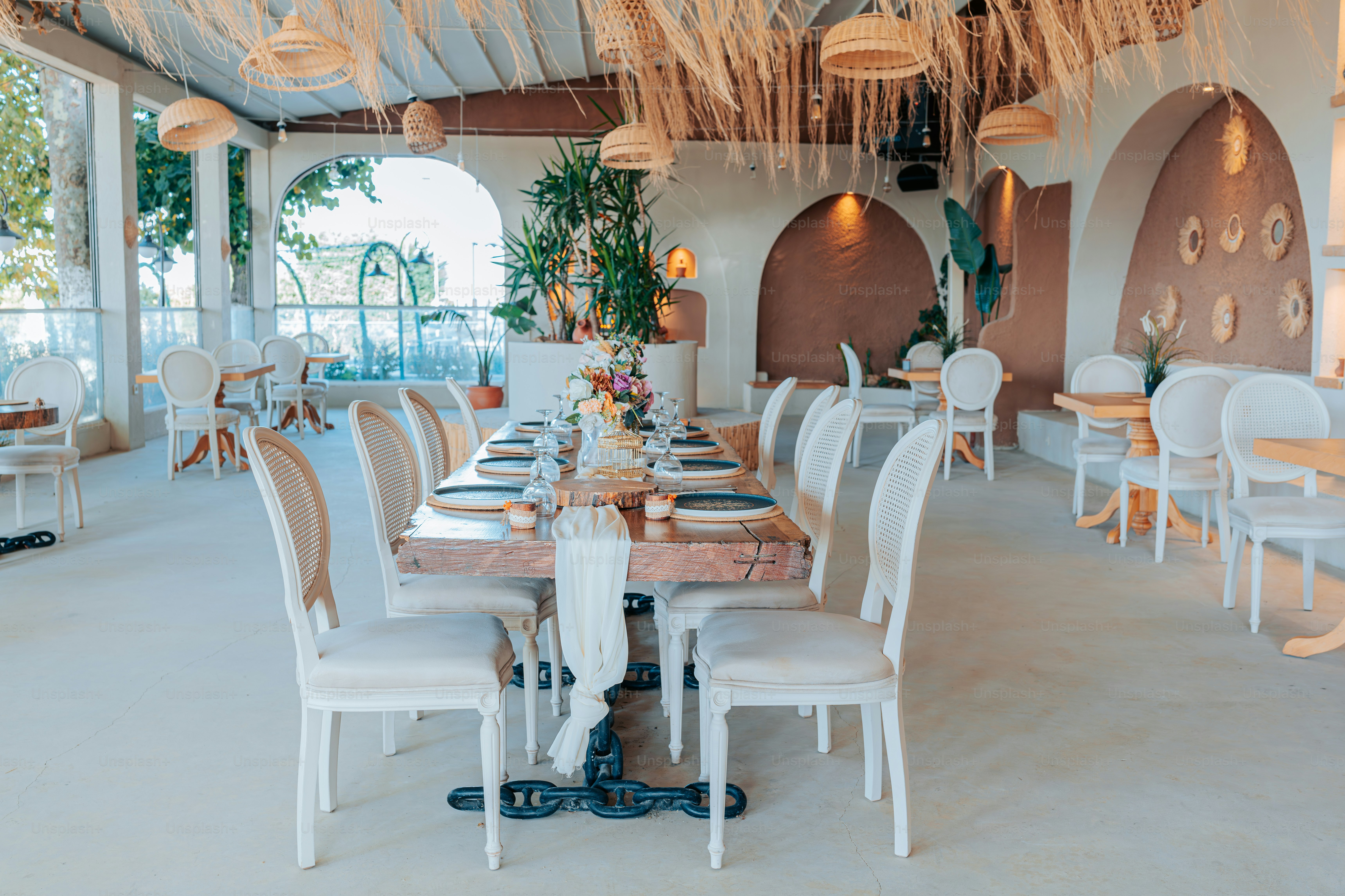 A dining room with a lot of tables and chairs