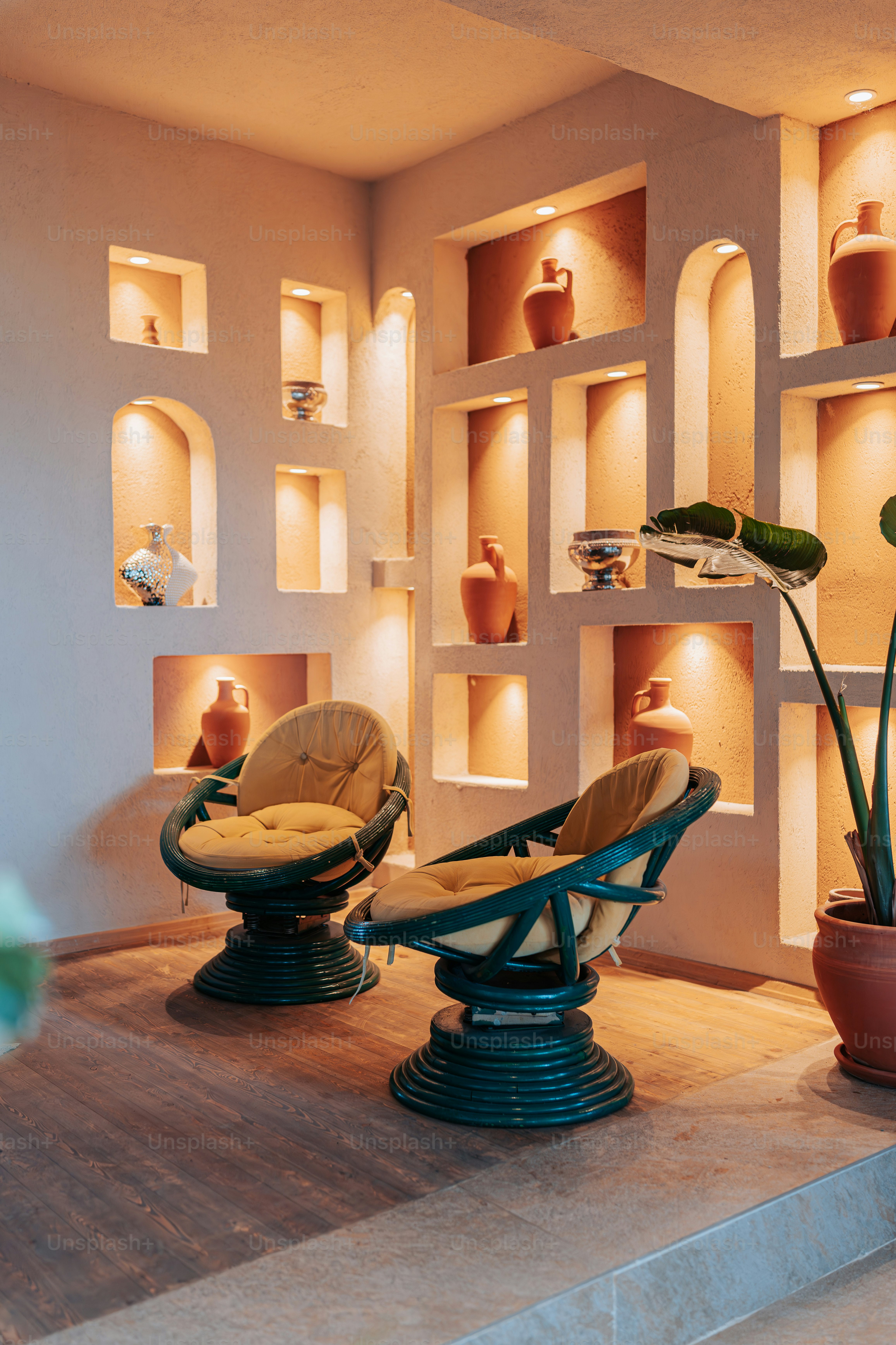 A room filled with lots of shelves filled with vases