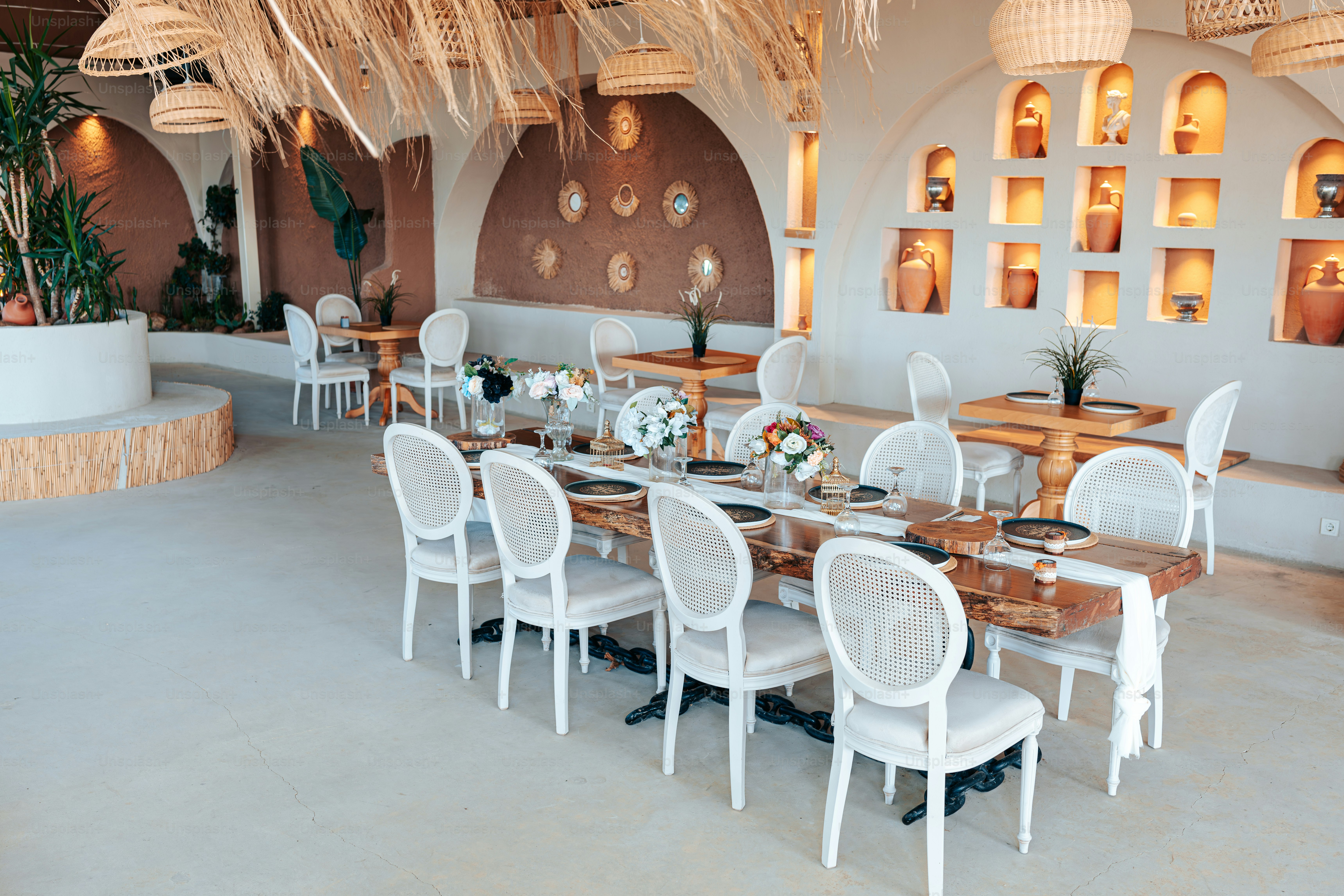 A restaurant with a large table and chairs