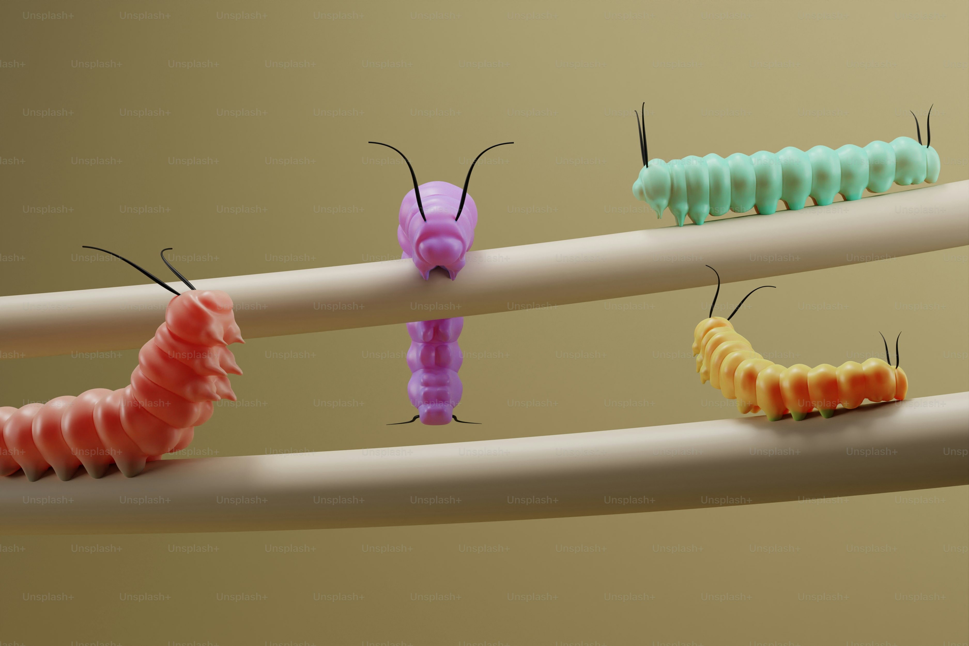 A group of caterpillars sitting on top of a white pipe