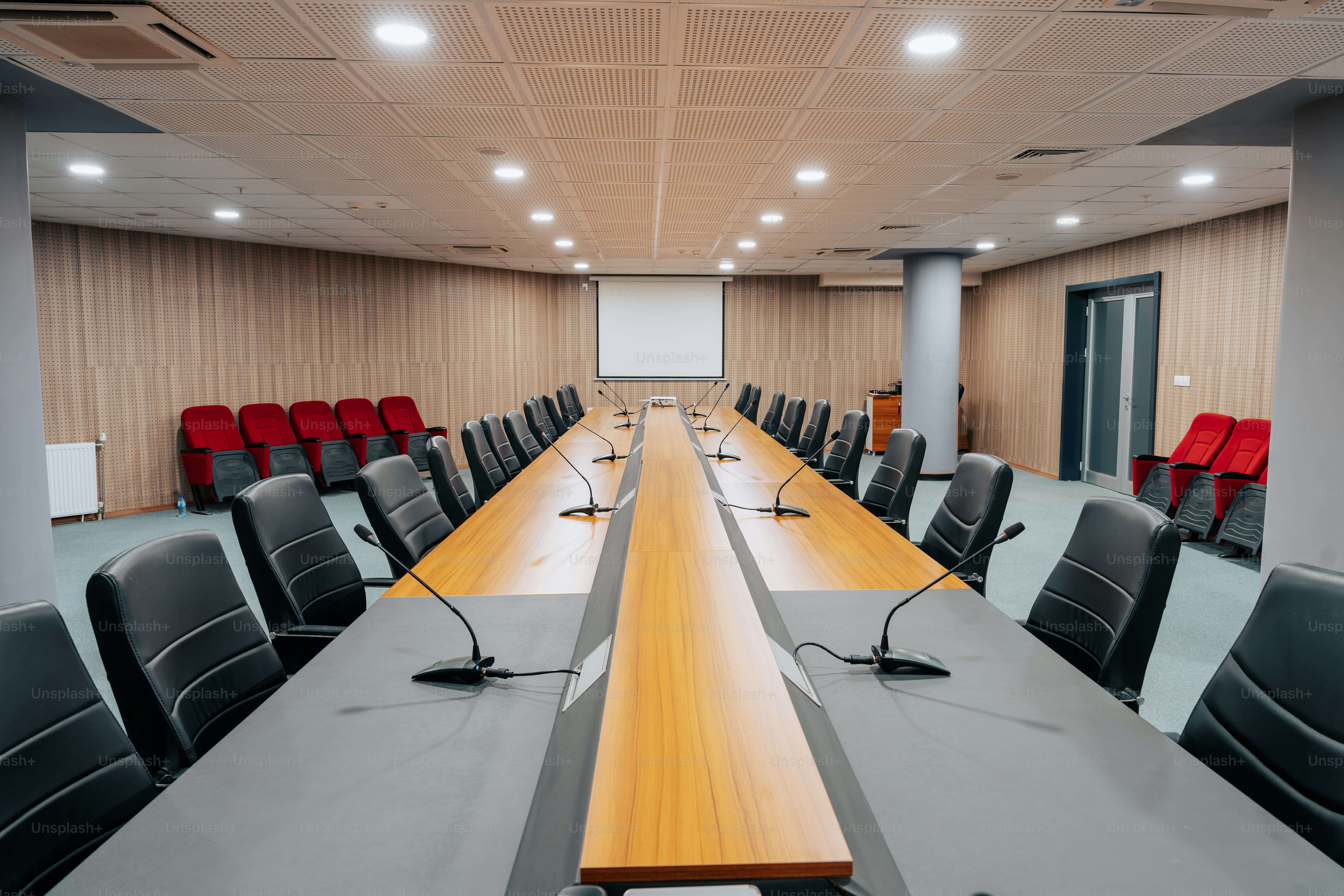 A conference room with a long table and chairs