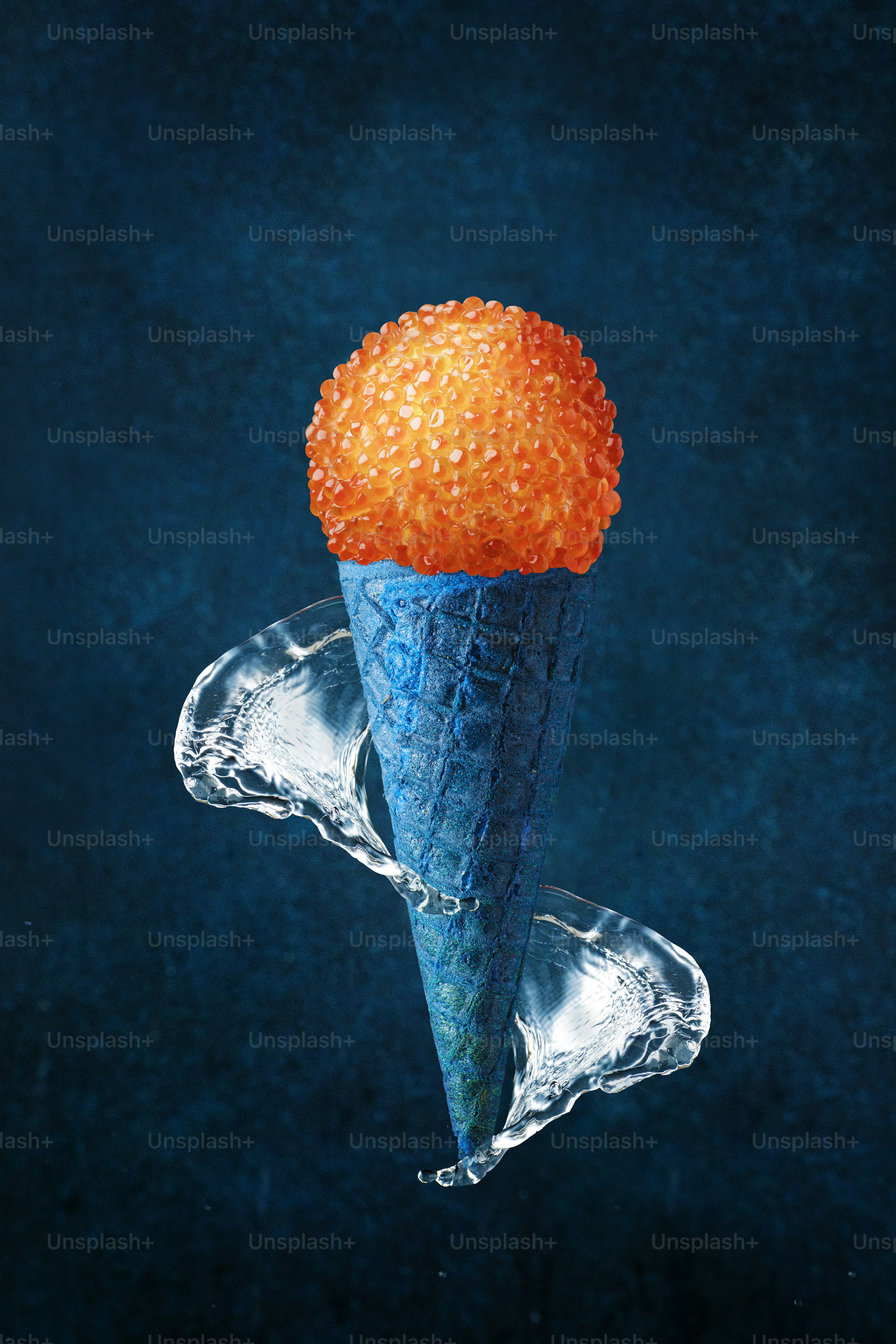 An ice cream cone with an orange on top