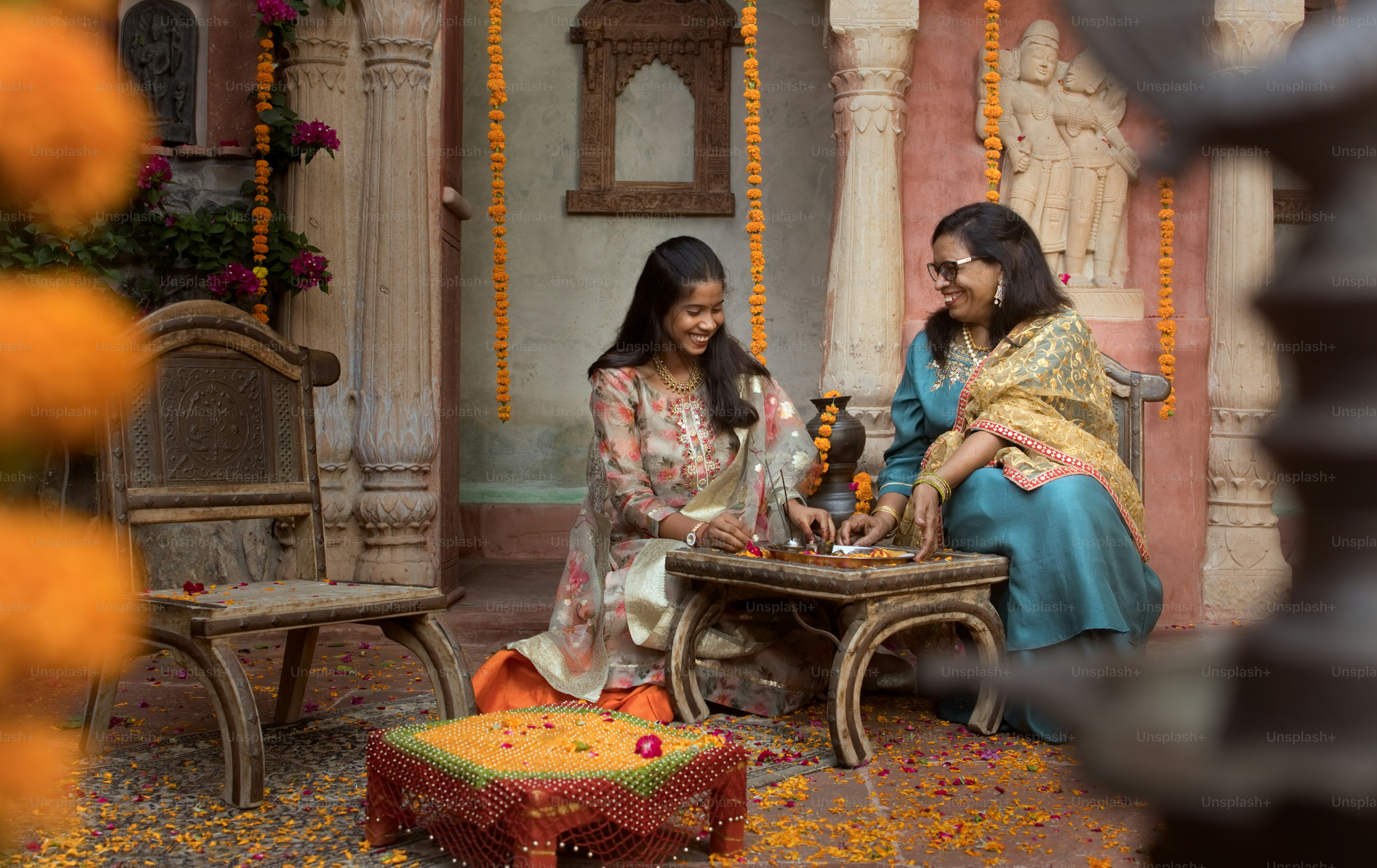 A couple of women sitting next to each other