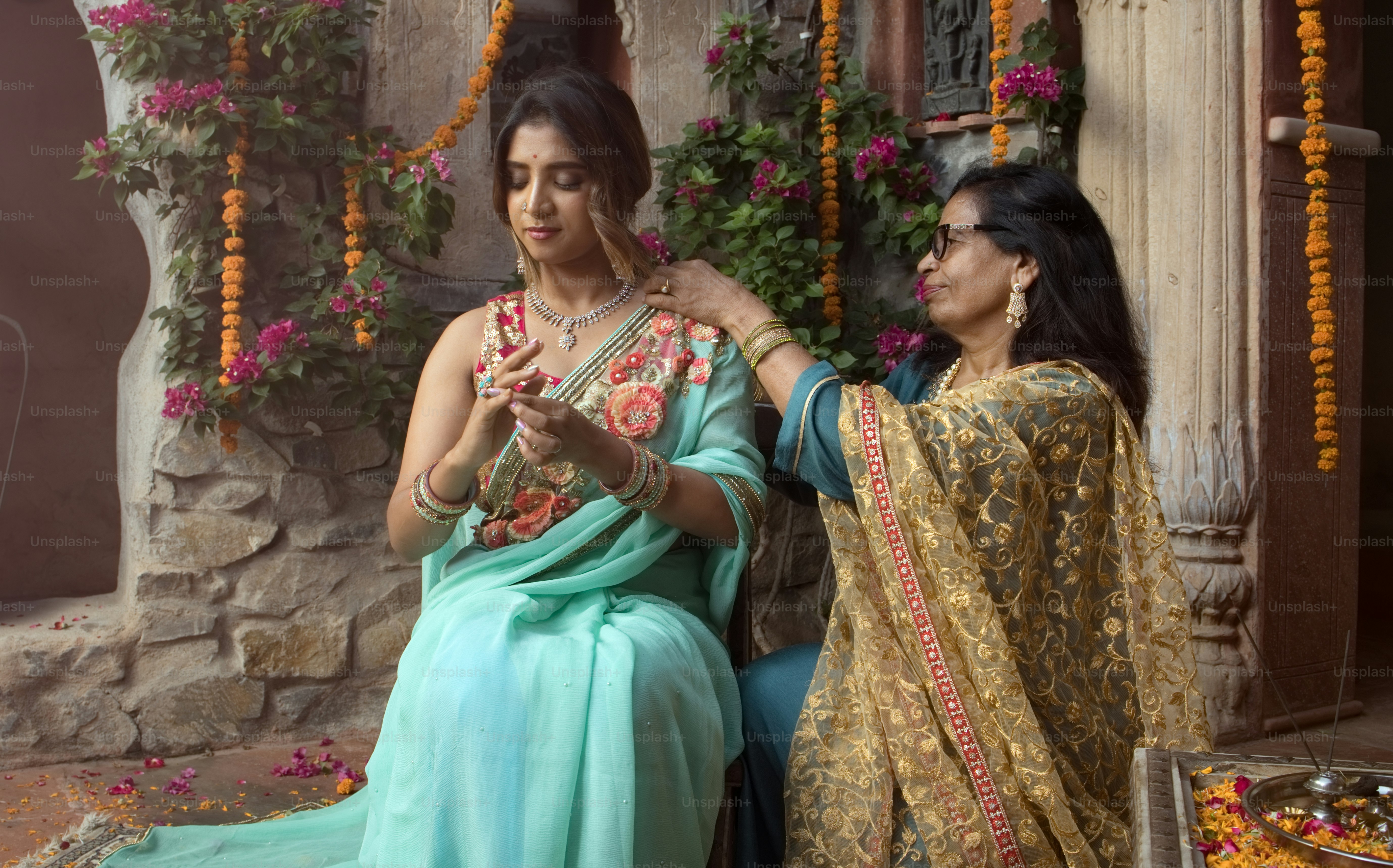 A couple of women sitting next to each other