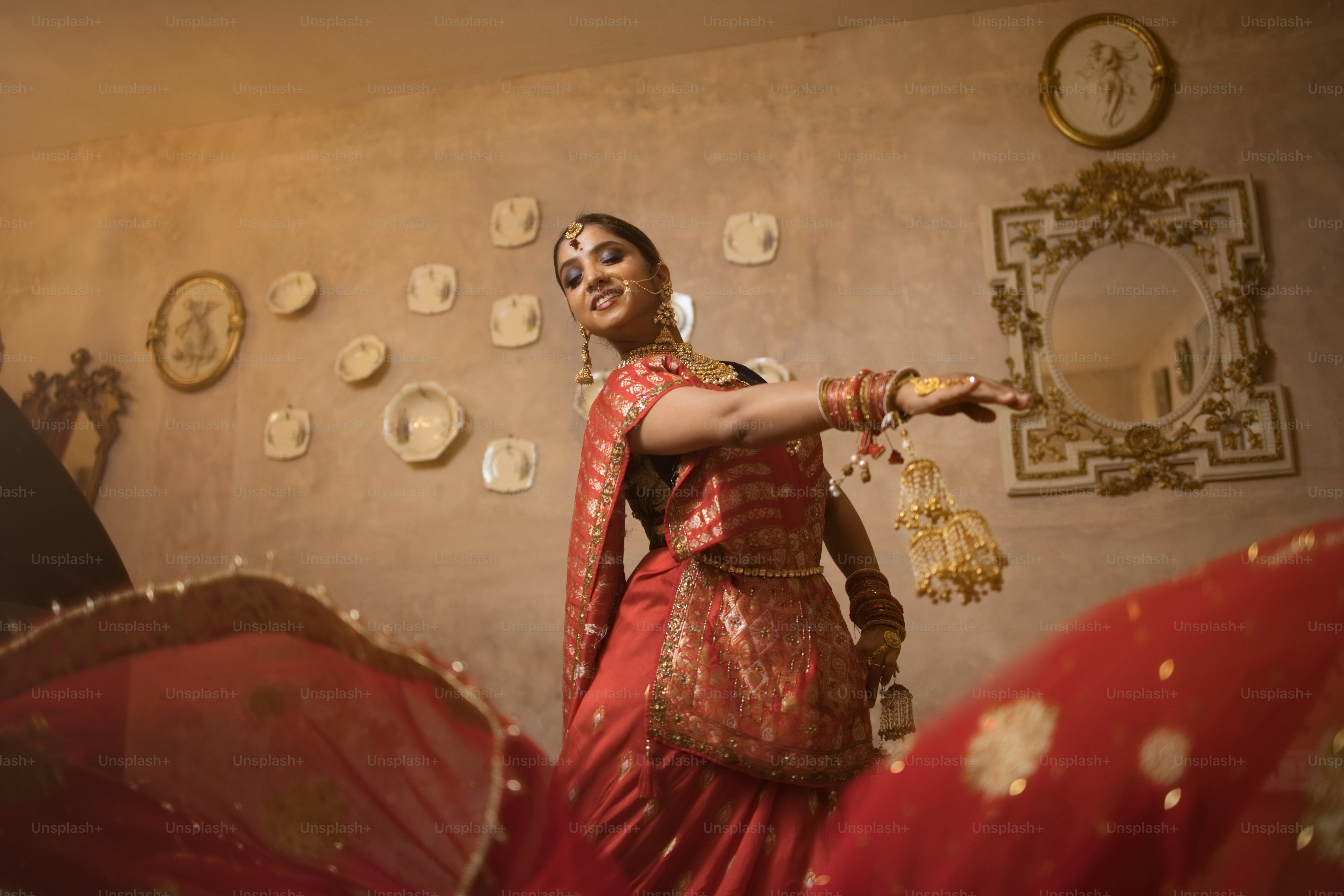 A woman in a red dress is dancing