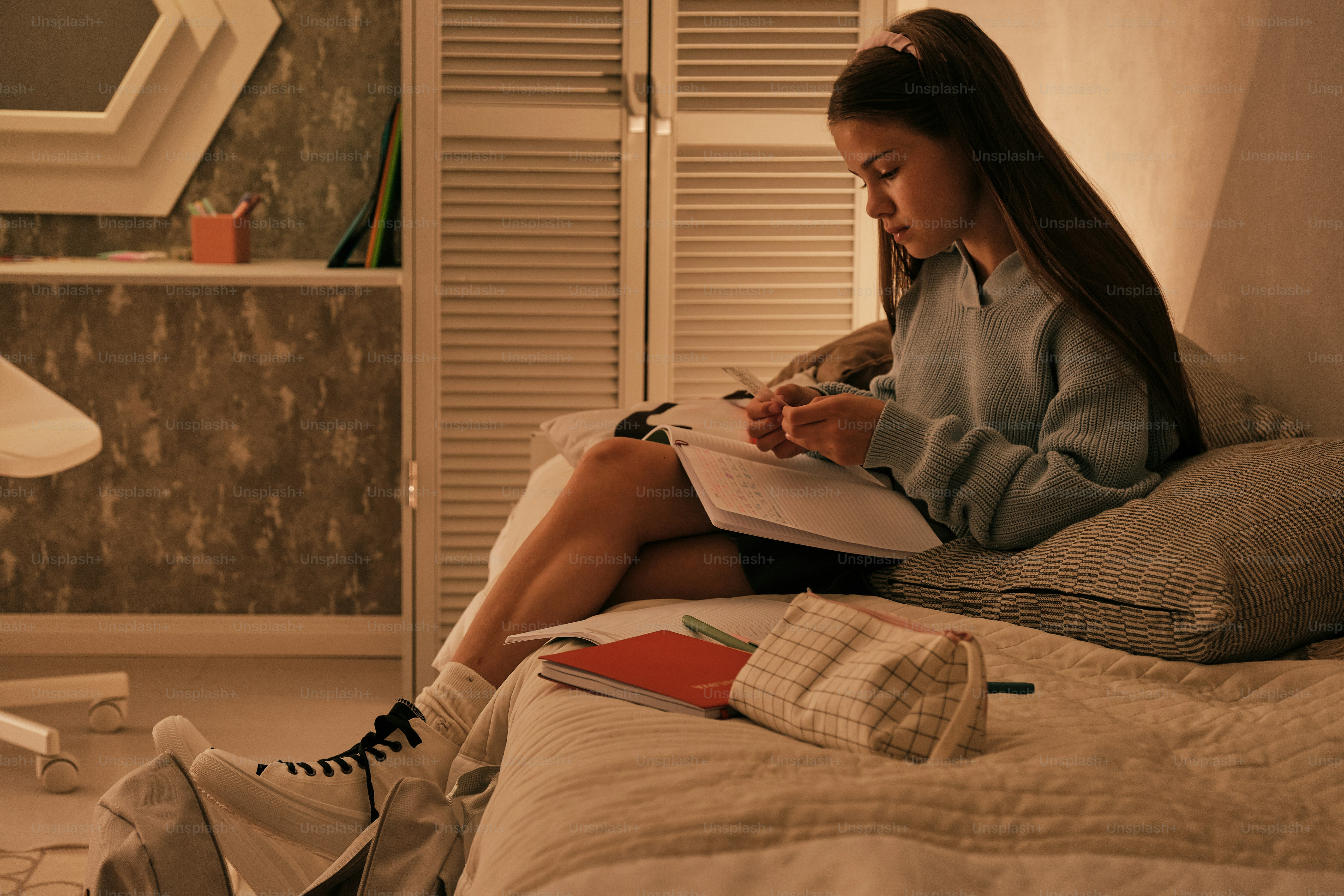 Homeowner planning a bedroom makeover budget with renovation note