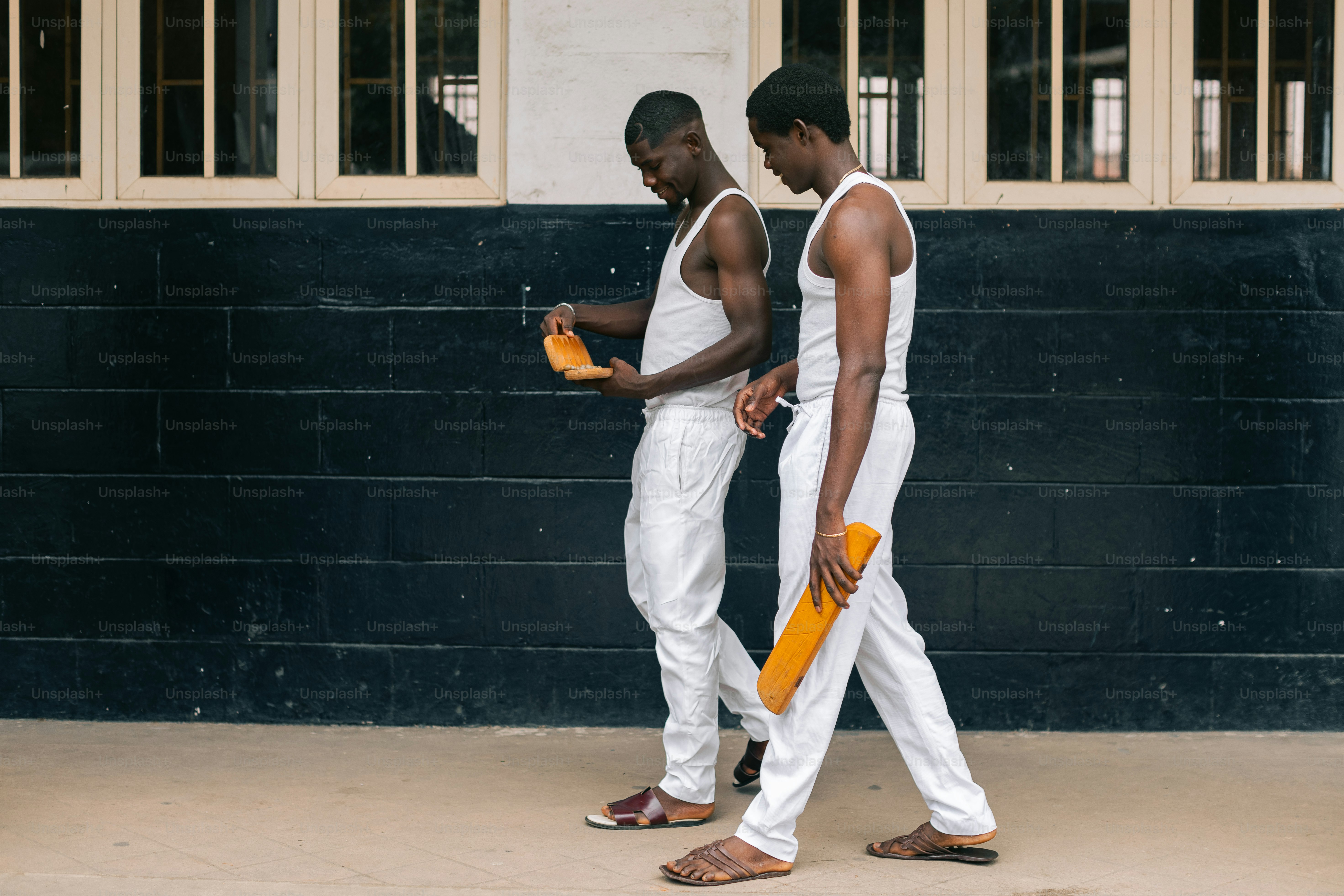 A couple of men standing next to each other
