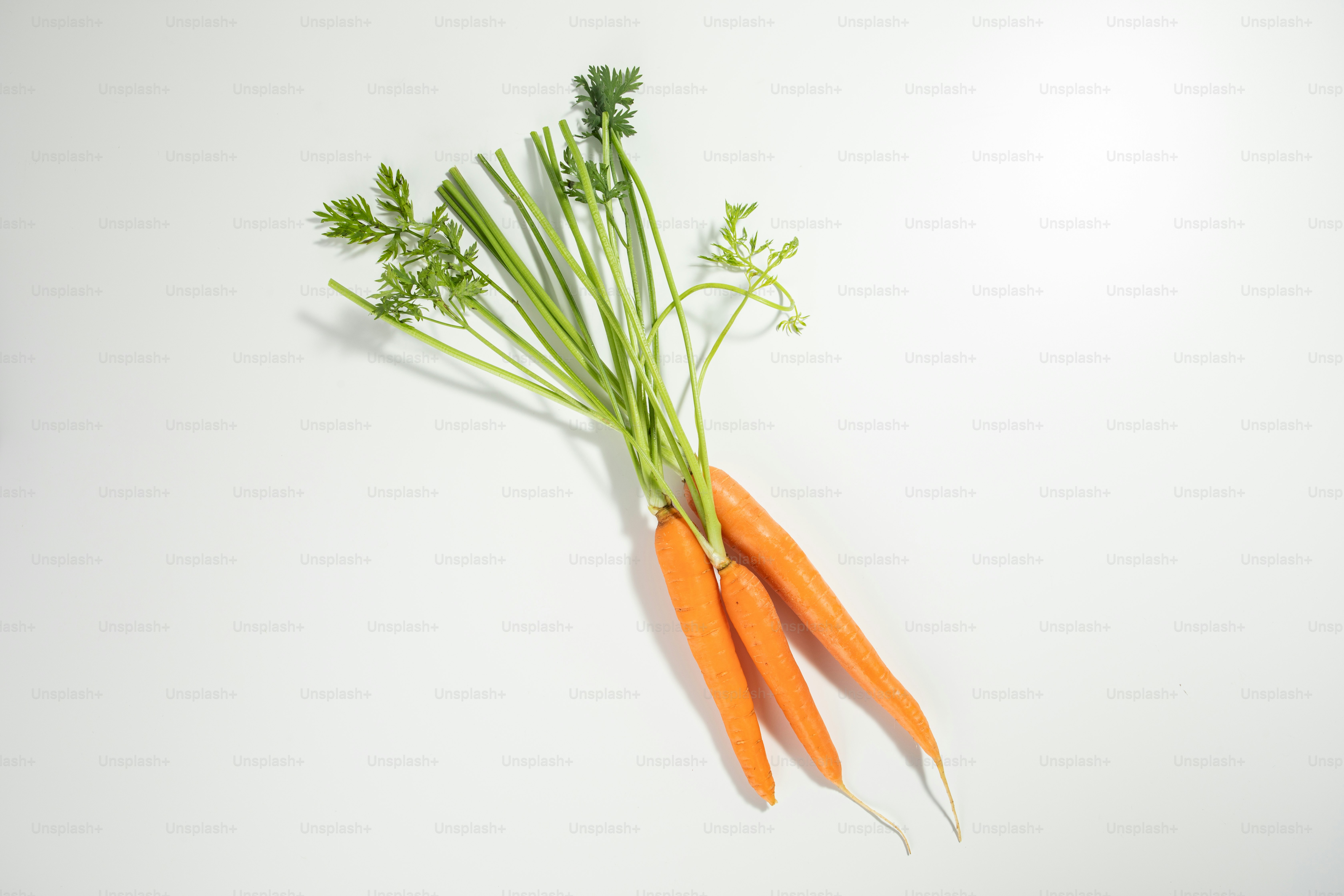 A couple of carrots sitting on top of a table