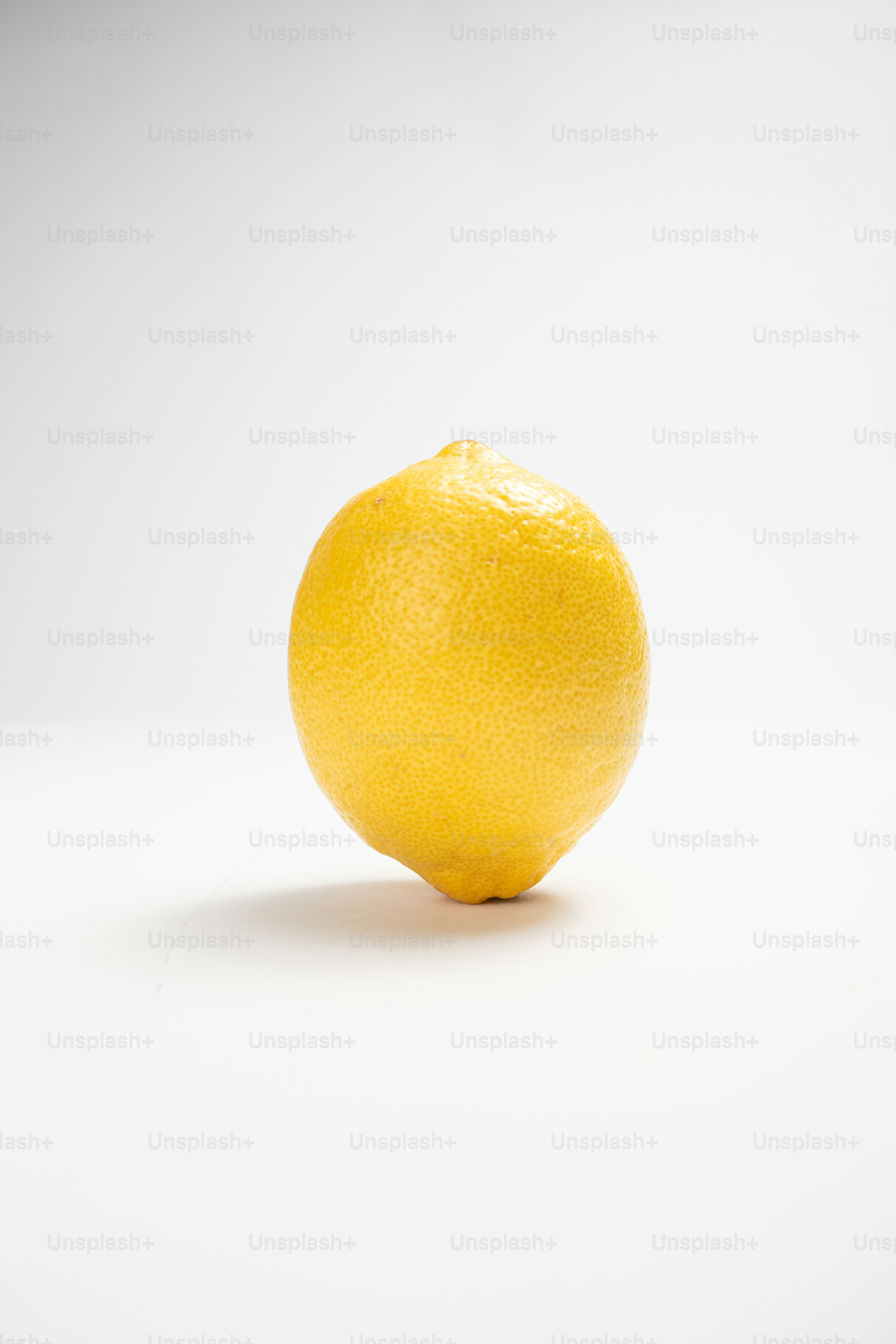 A single lemon on a white background