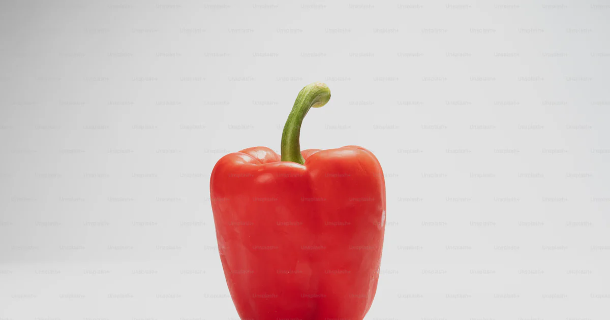Single Peper A single red pepper on a white background photo – Healthy food Image on ...