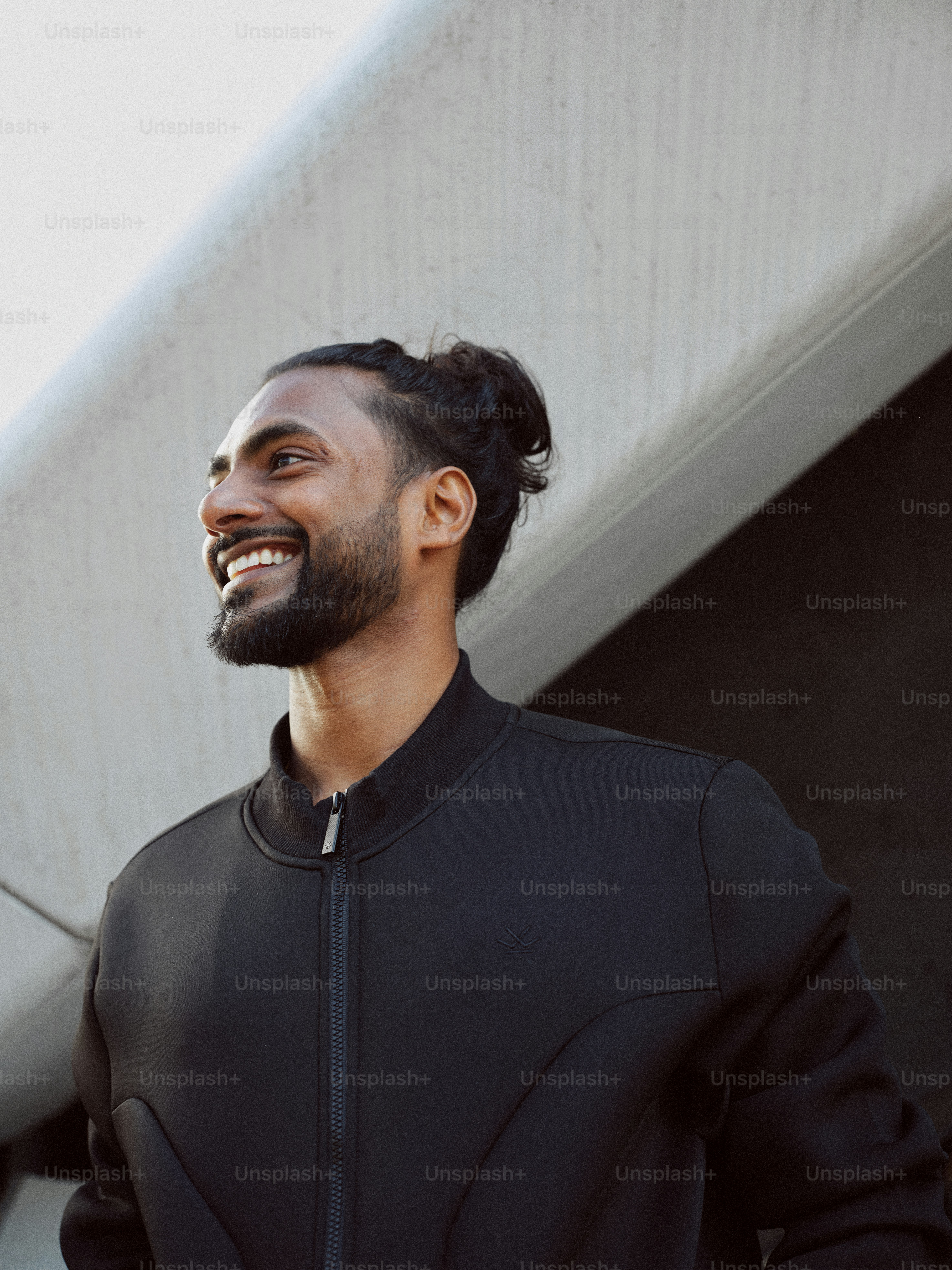 A man standing in front of a building smiling