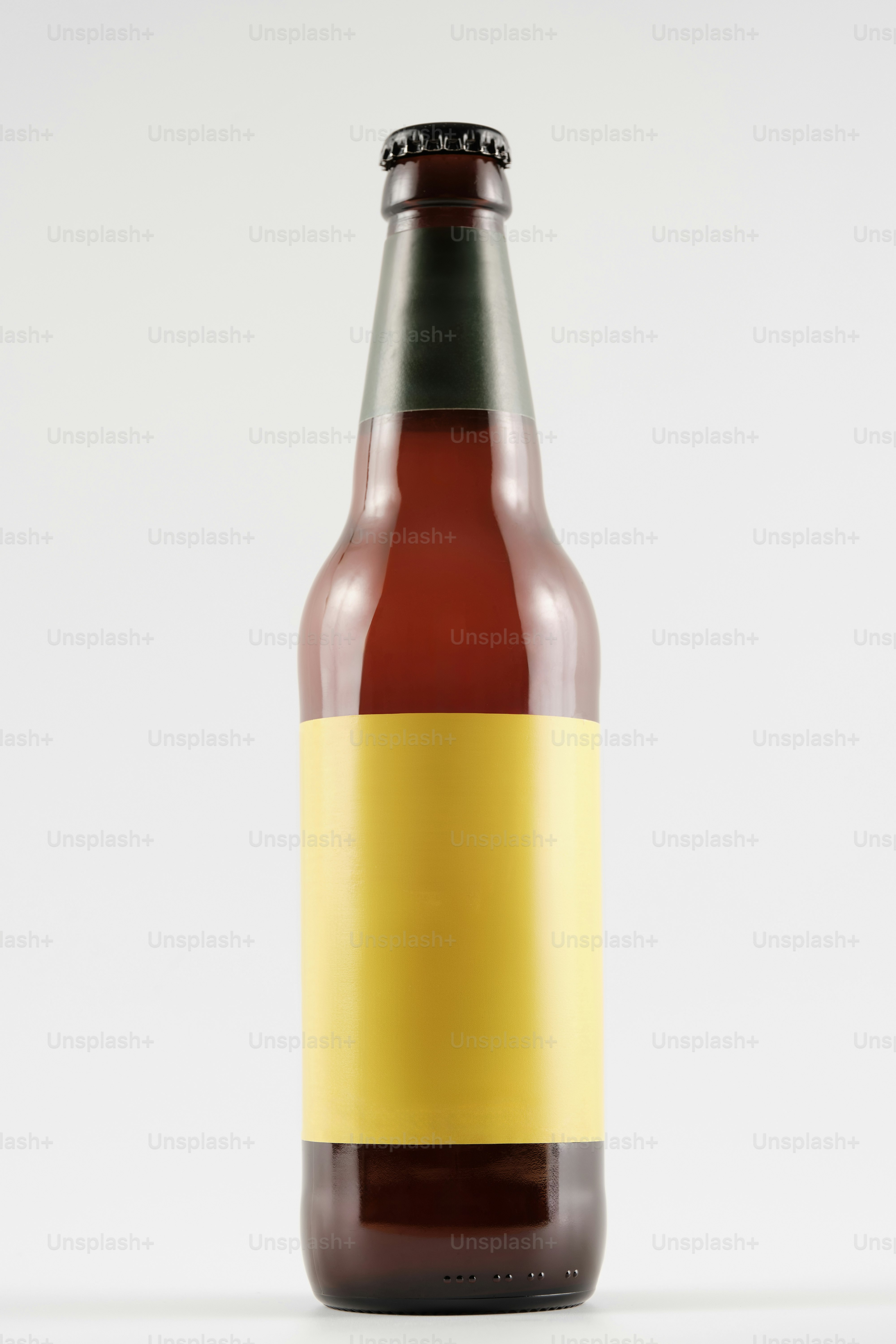 A bottle of beer with a yellow stripe