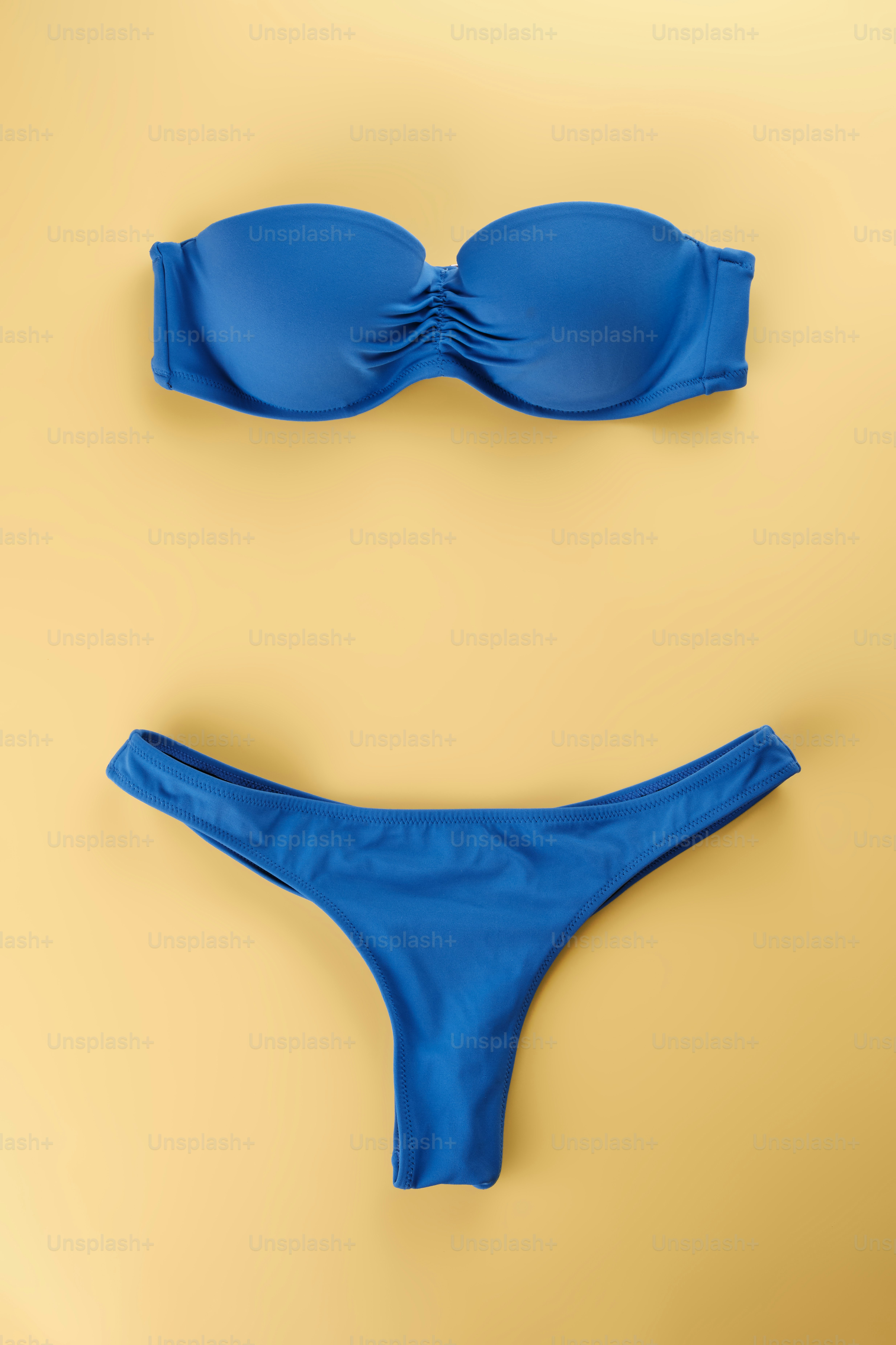 A blue bikinisuit with a bow on the side