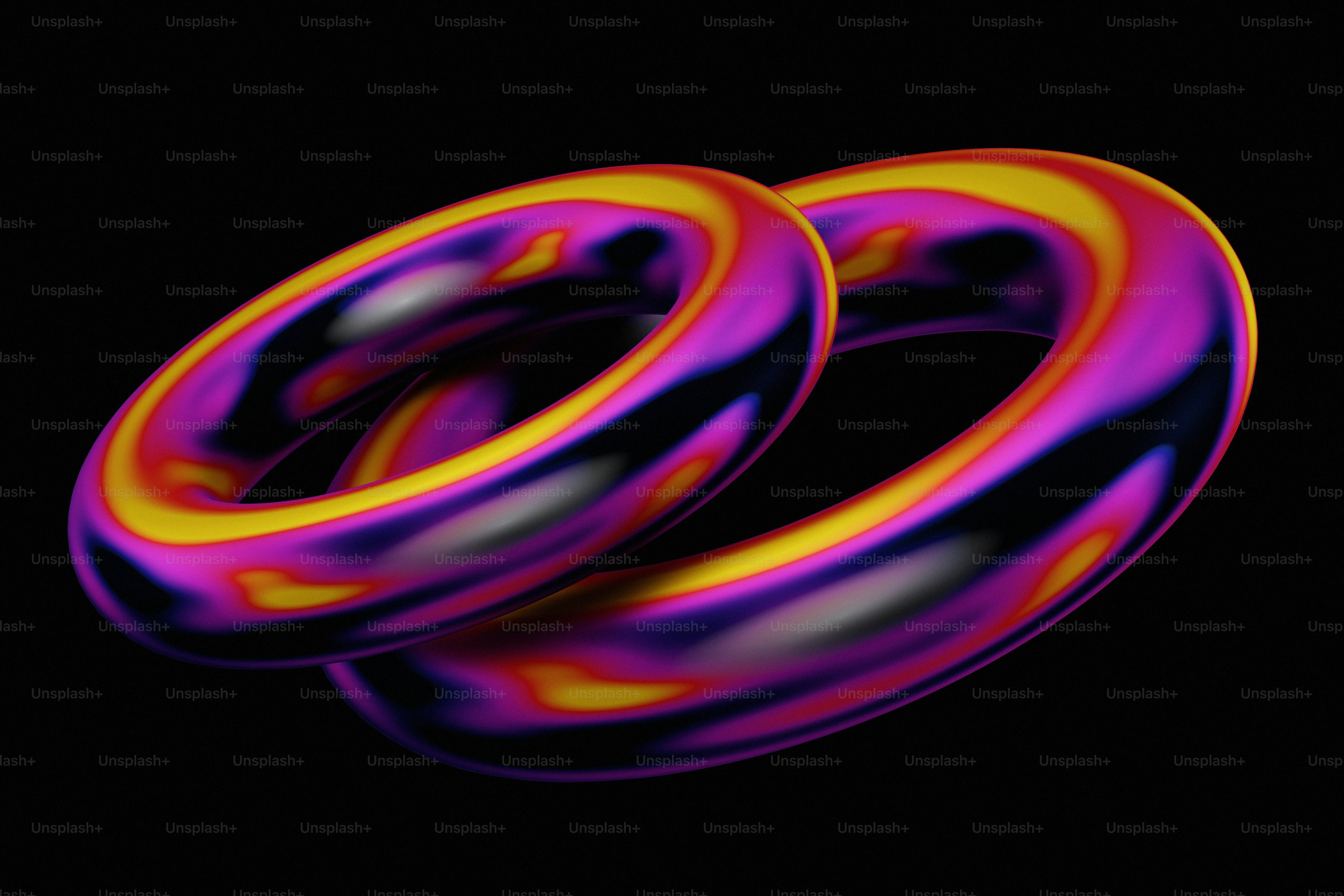 A pair of colorful rings on a black background