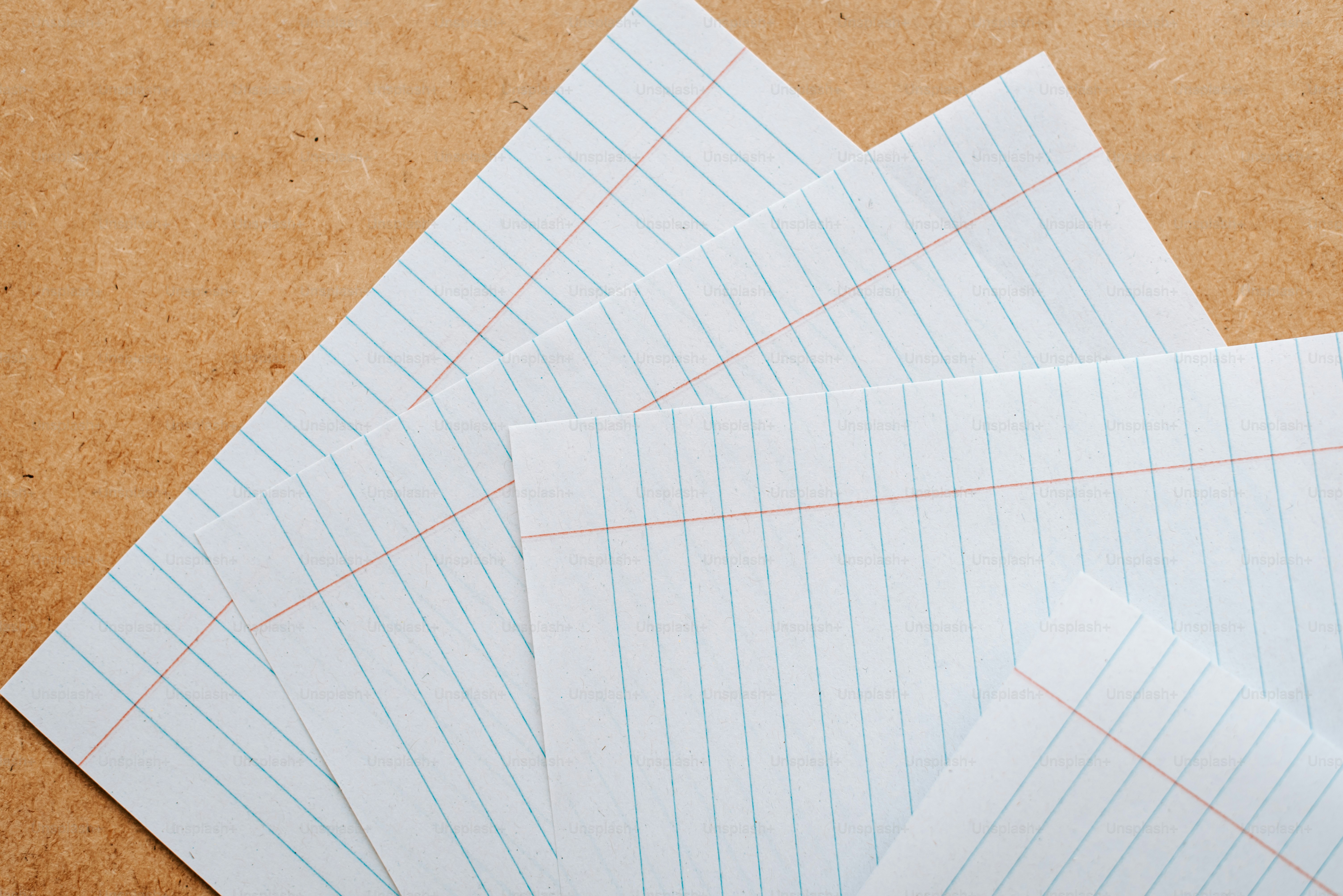 Four pieces of paper laid out on a table