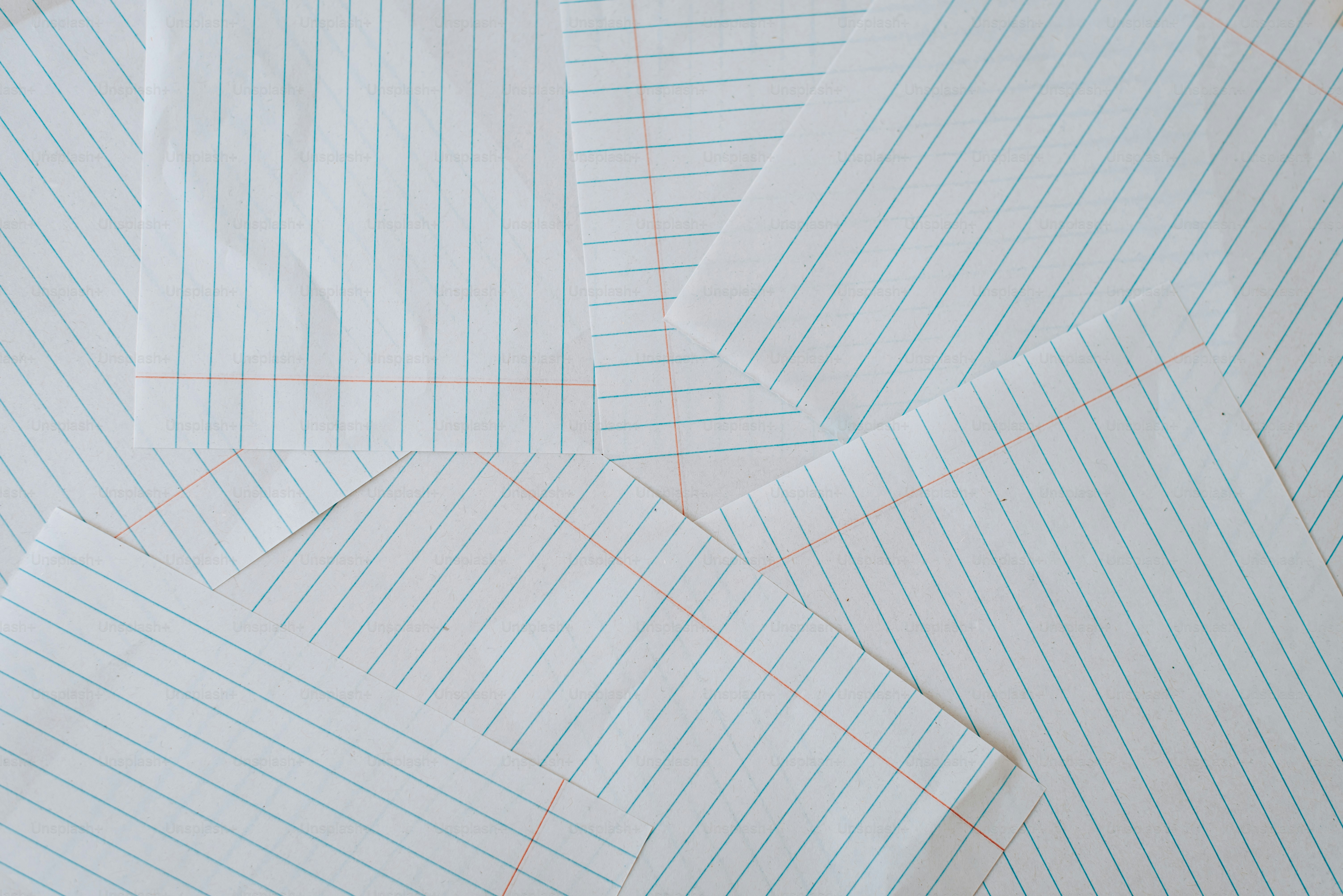 A pile of white and blue striped shirts