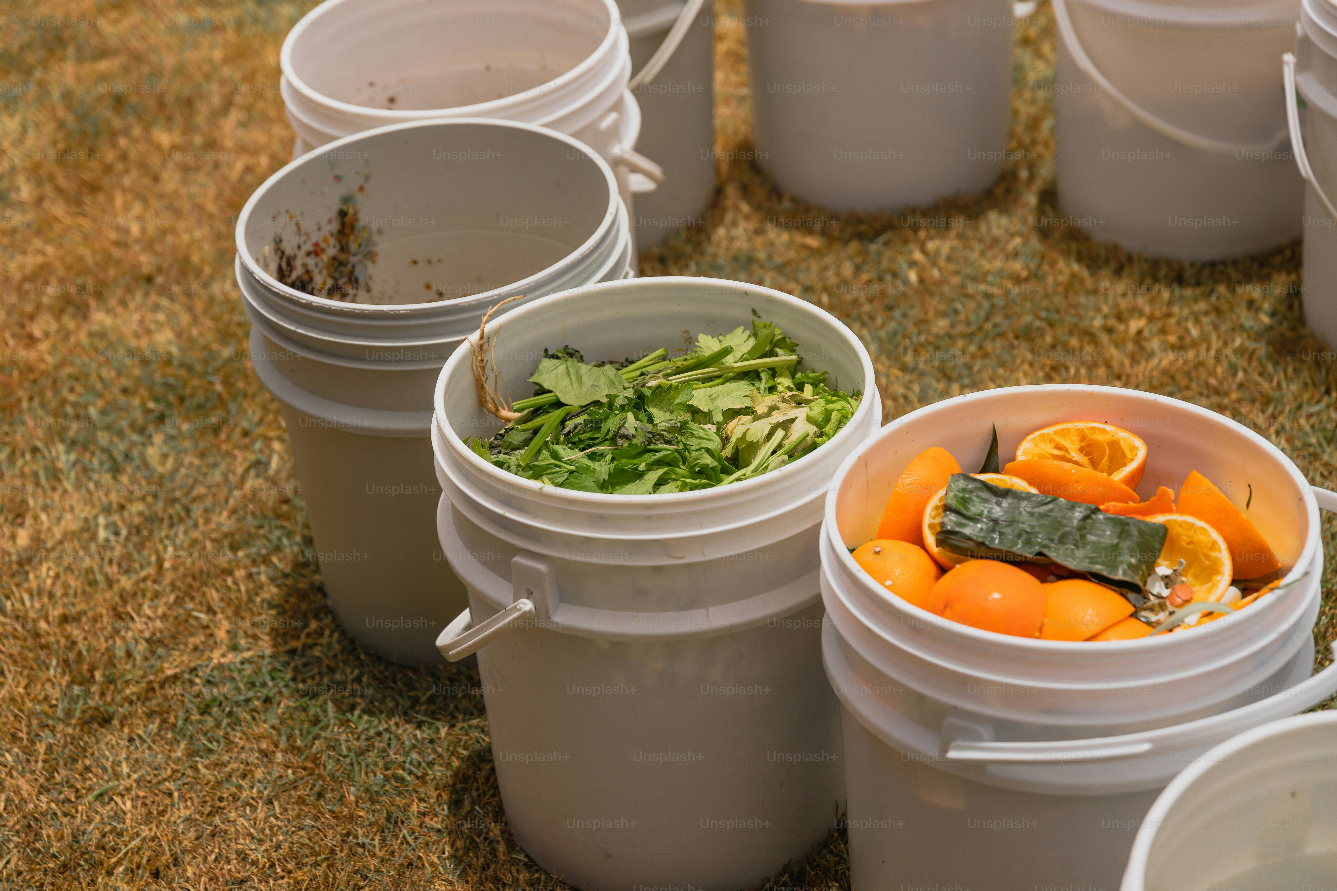 A bunch of buckets filled with different types of food