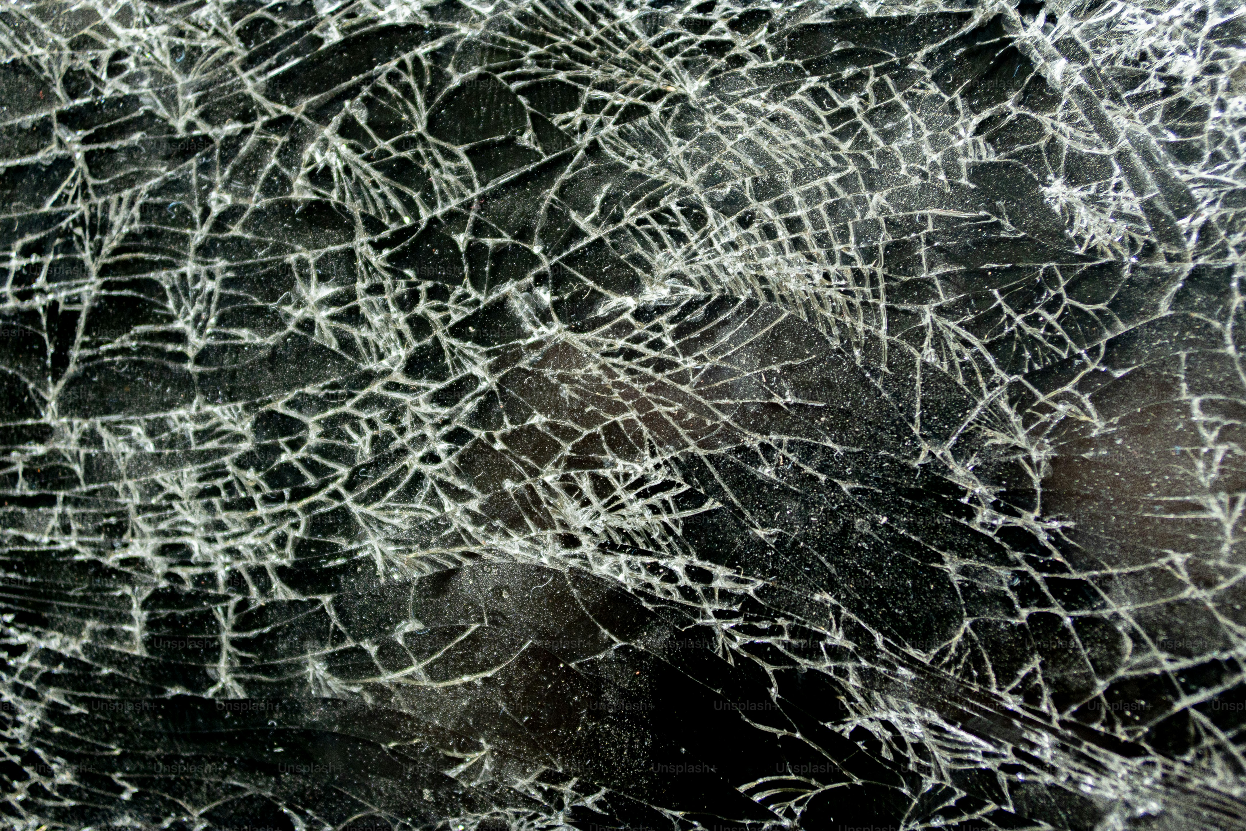 A close up of a cracked glass window