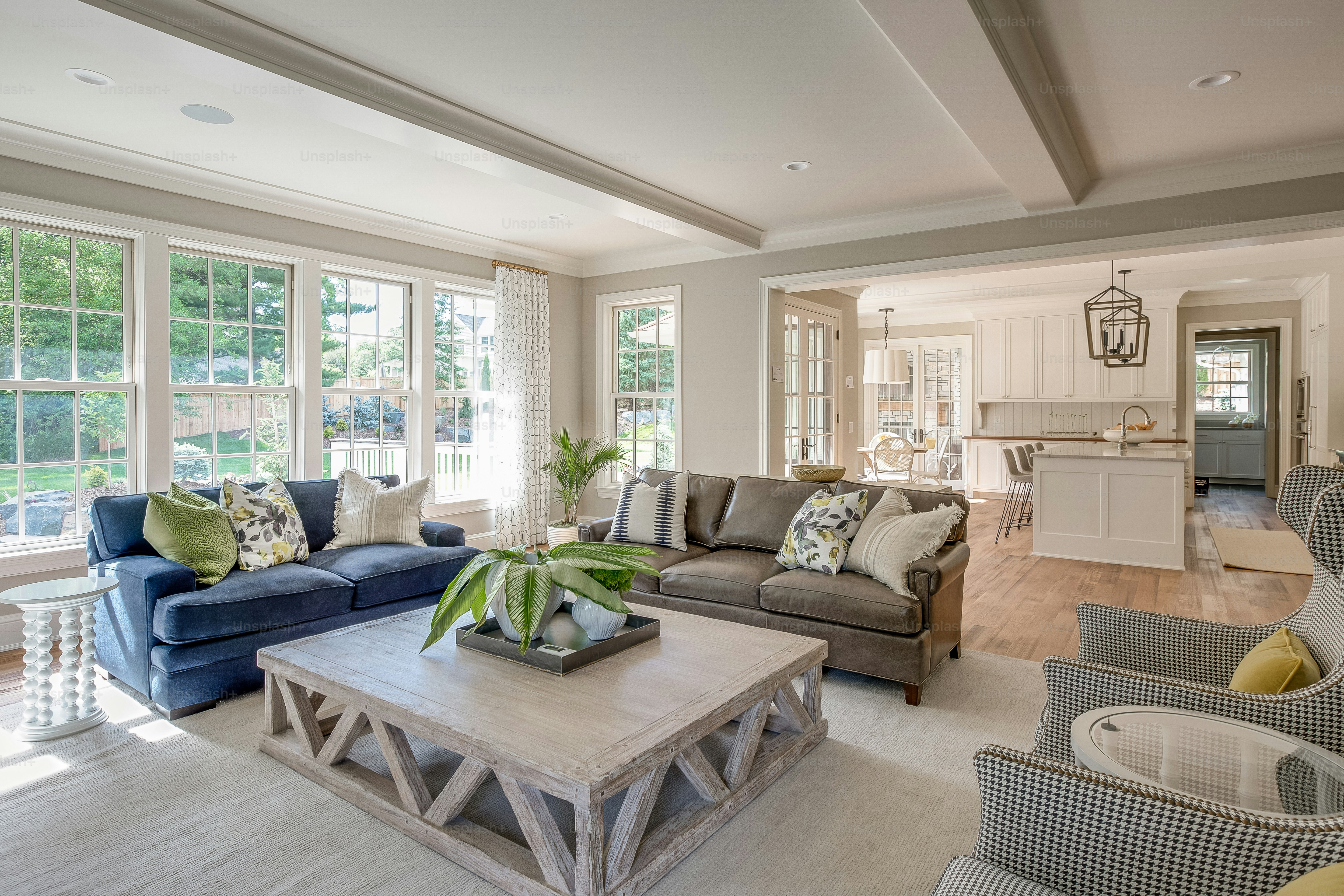 Kitchen in background with comfortable seating in large great room