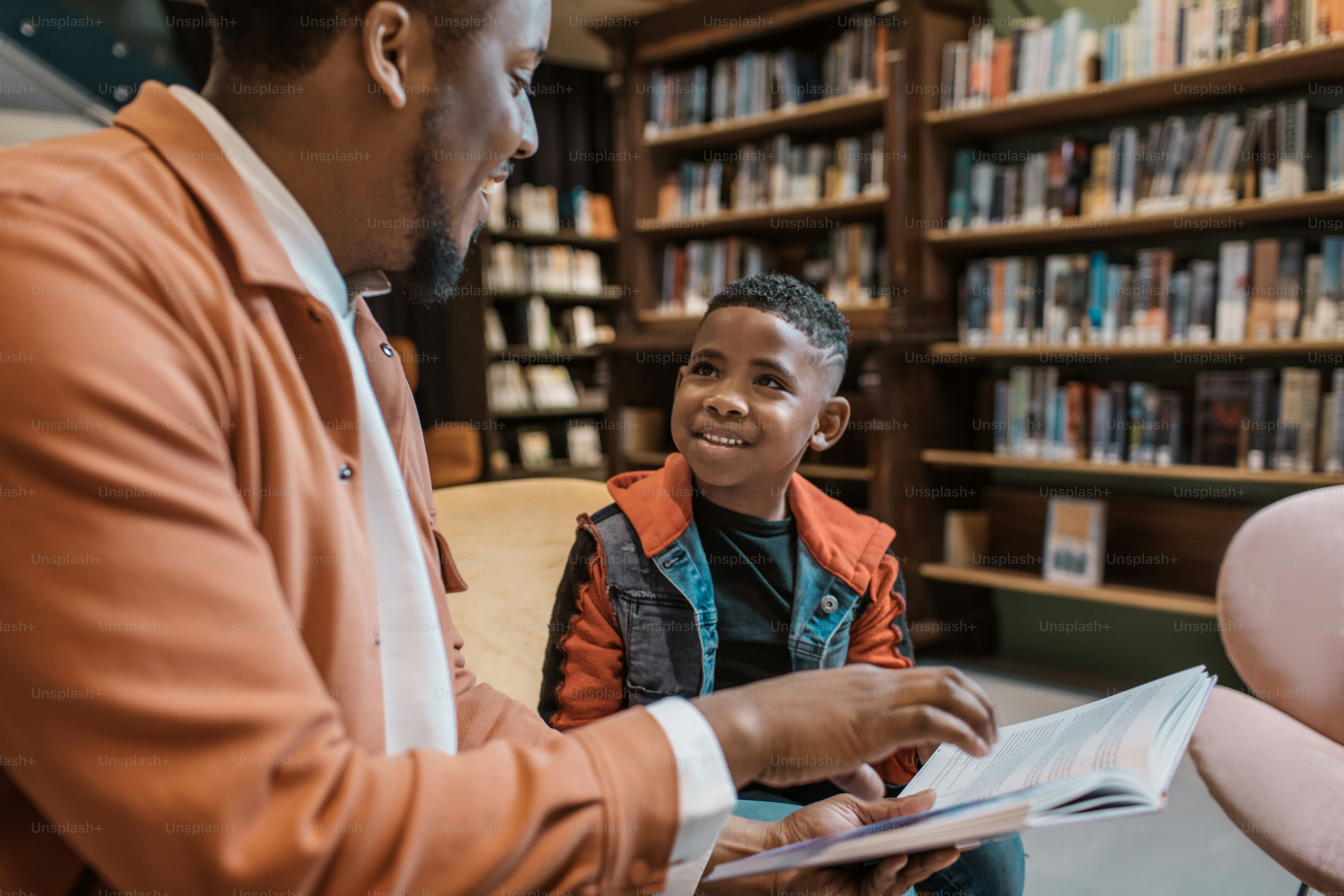 A group of young black and diverse school children in a dutch library