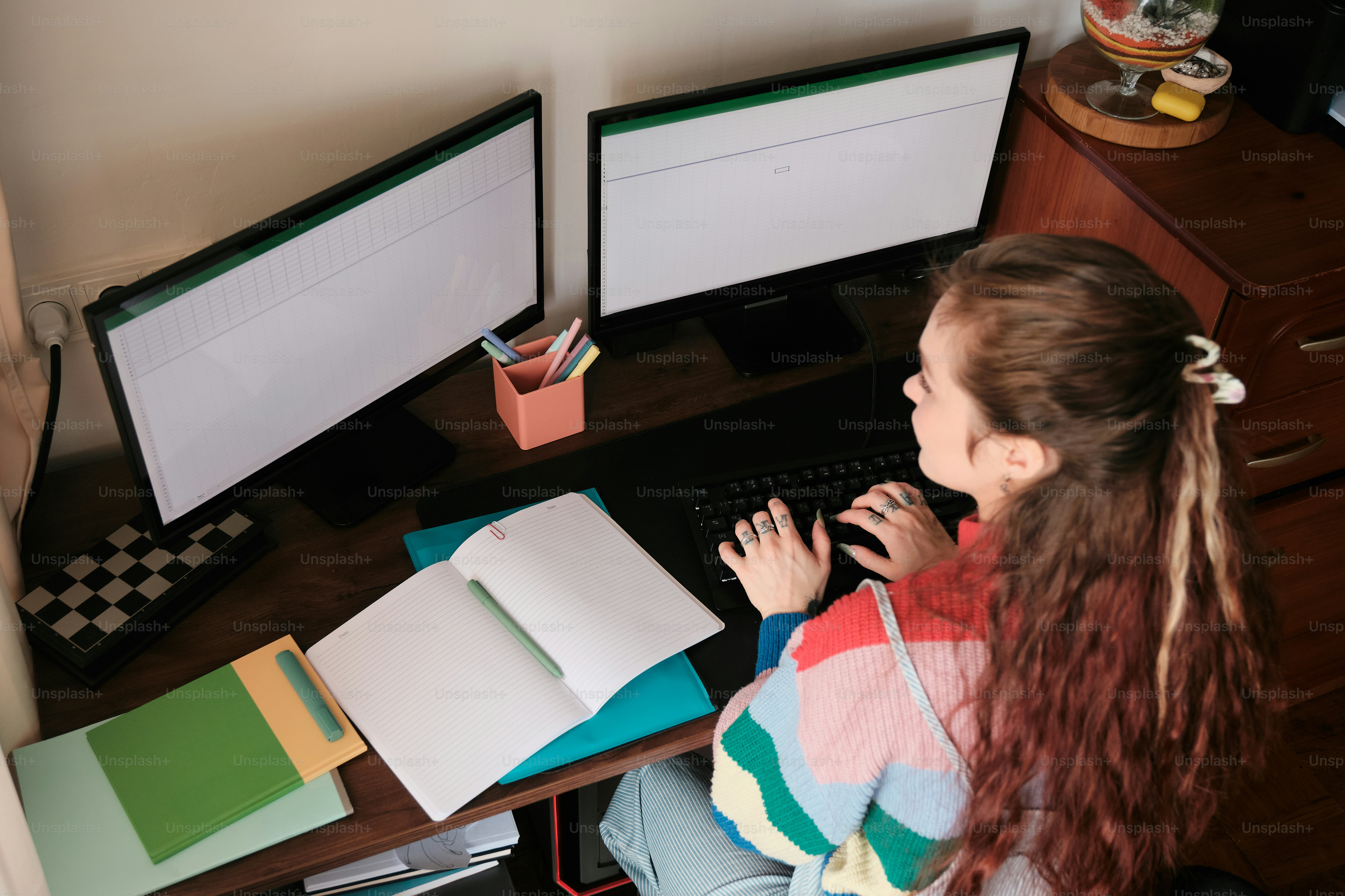 A little girl sitting at a desk with a computer photo – Student housing ...