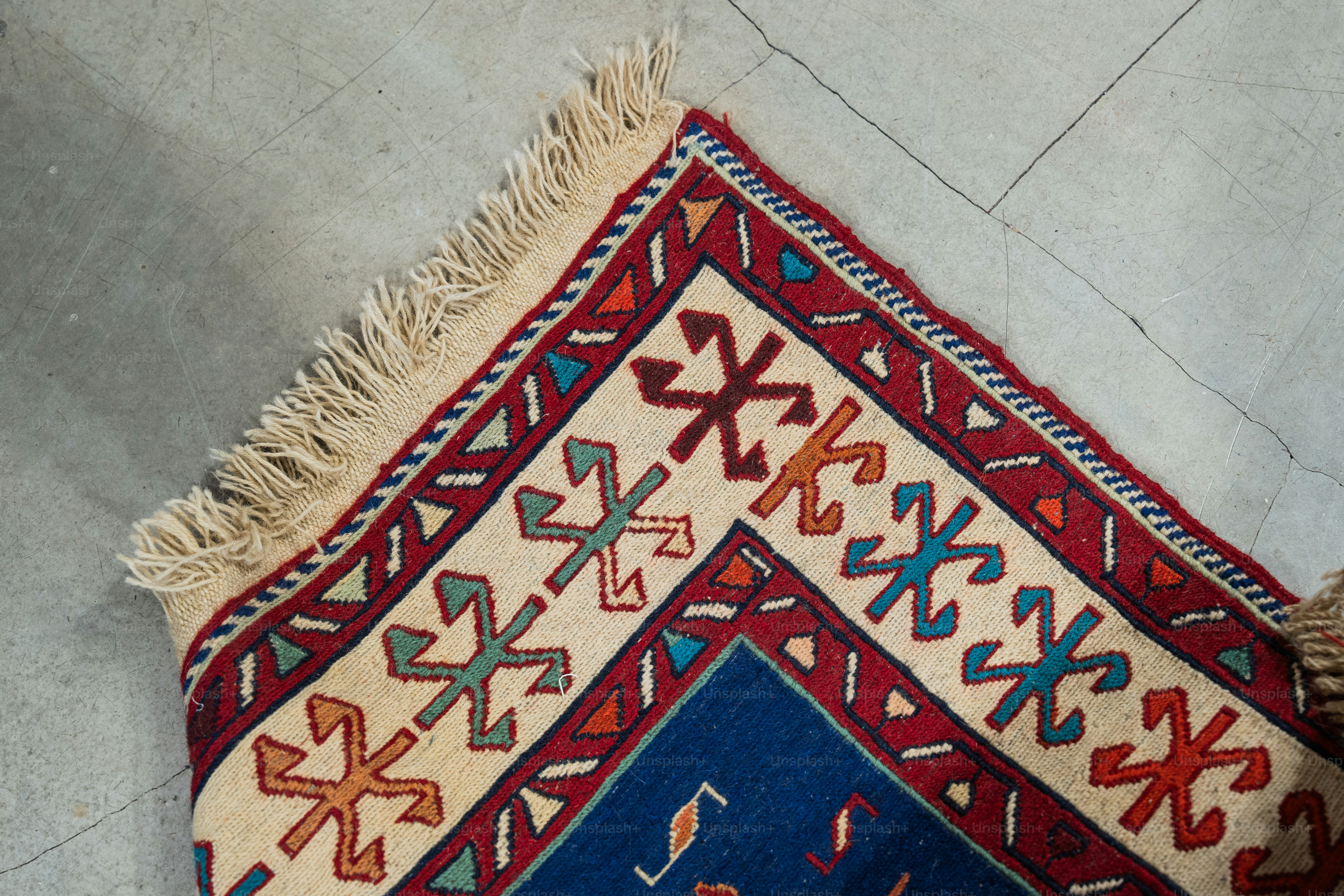 A rug with a blue and red design on it