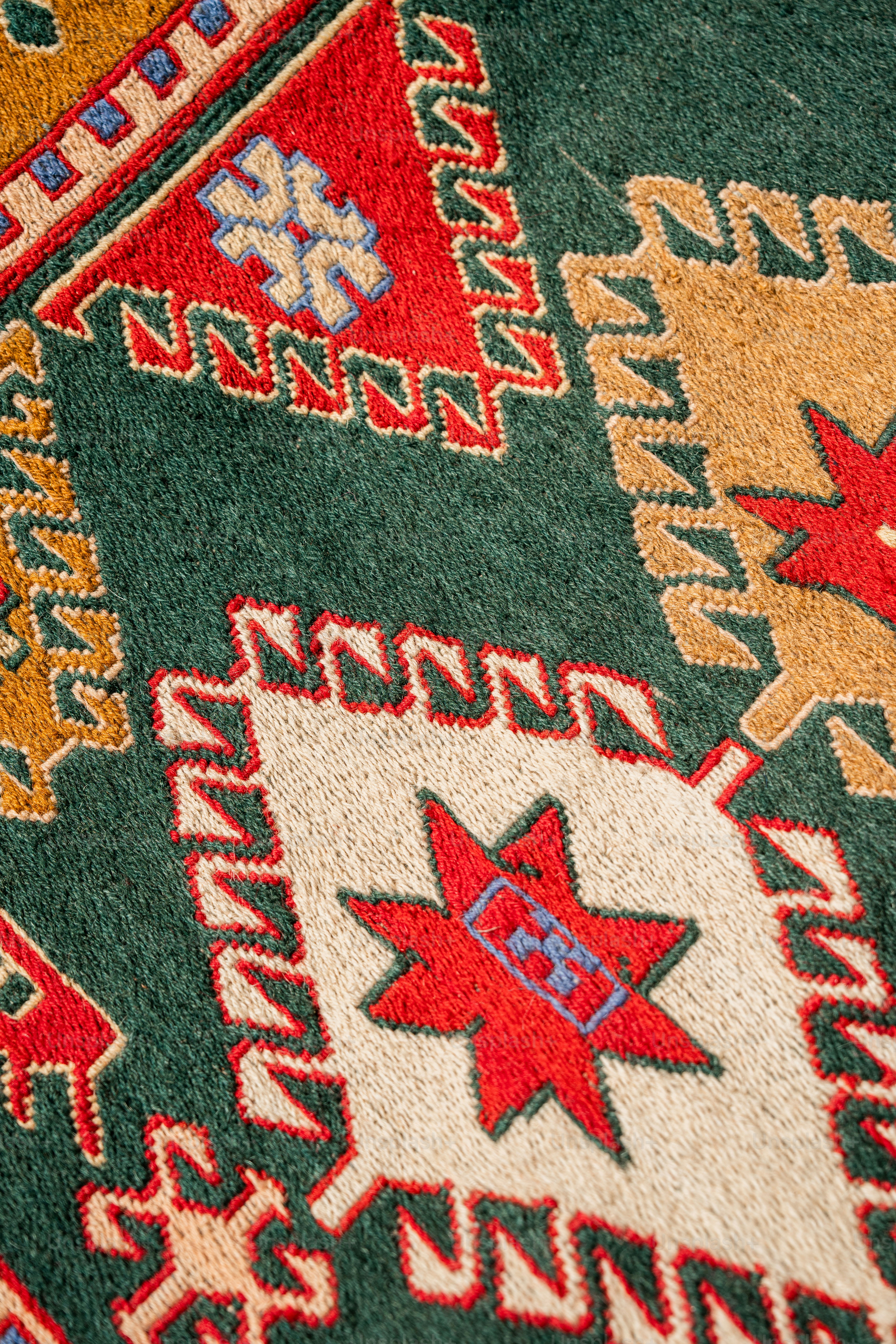 A close up of a rug with many different colors