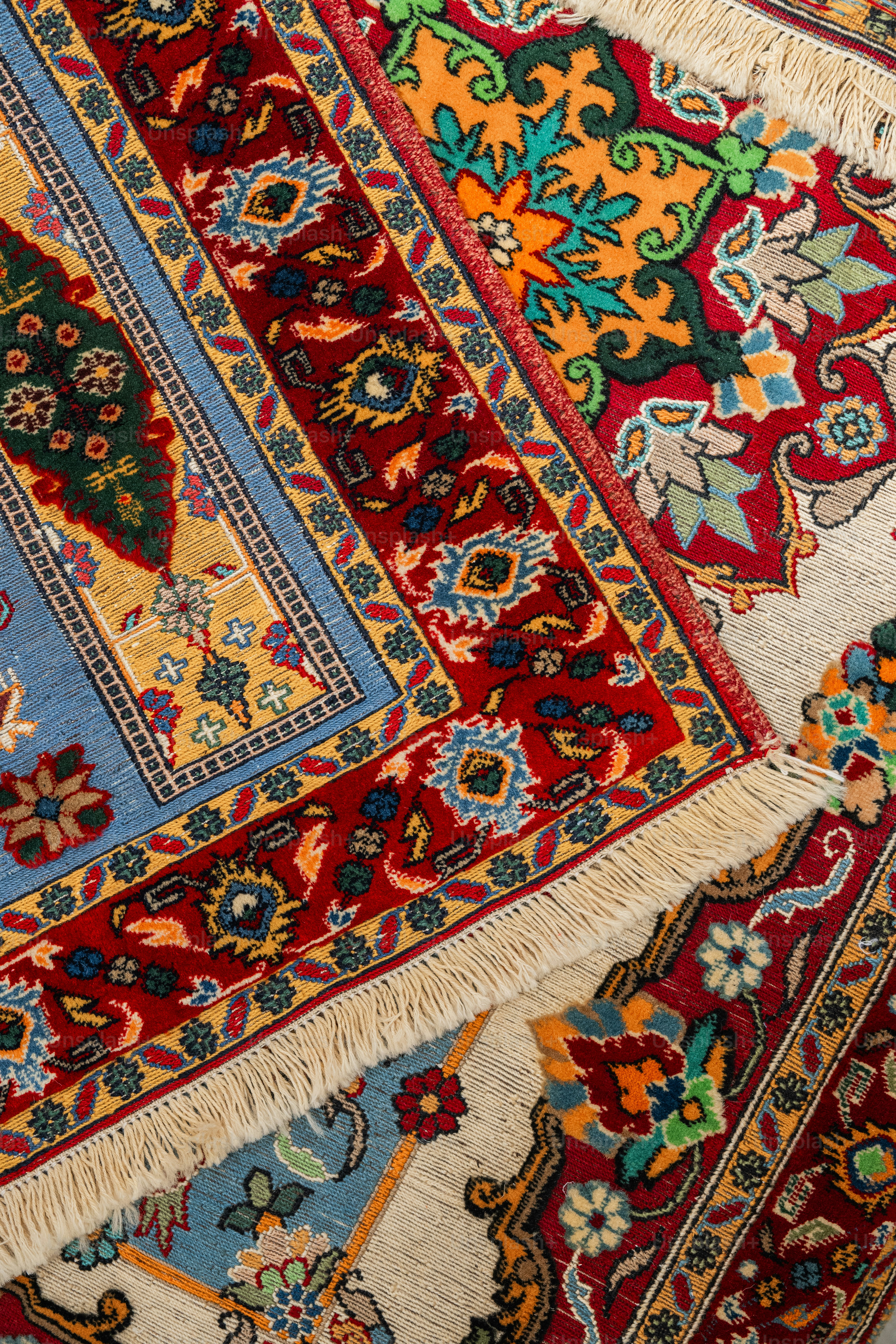 A close up of a rug with many different colors