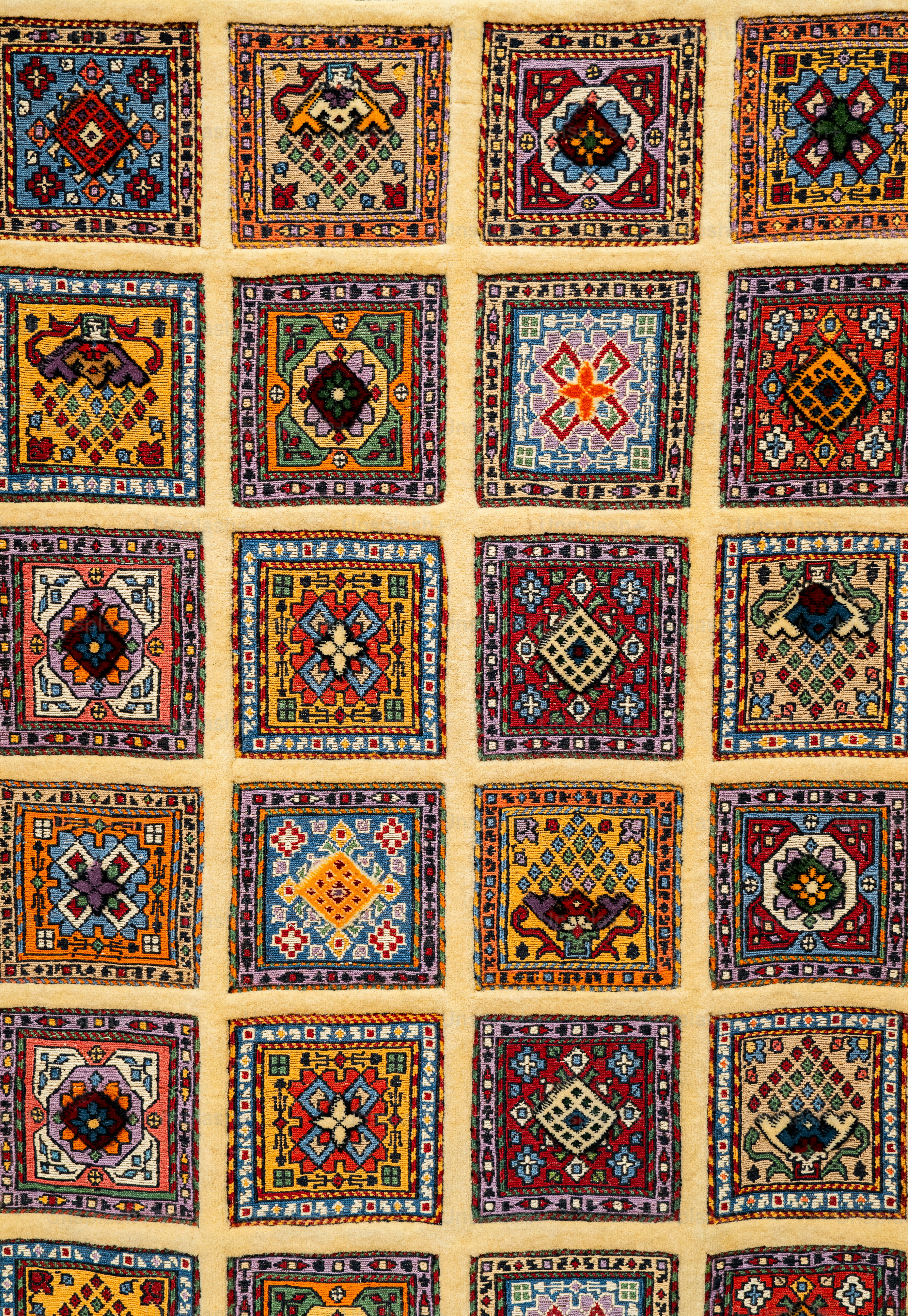 A quilt with many different designs on it