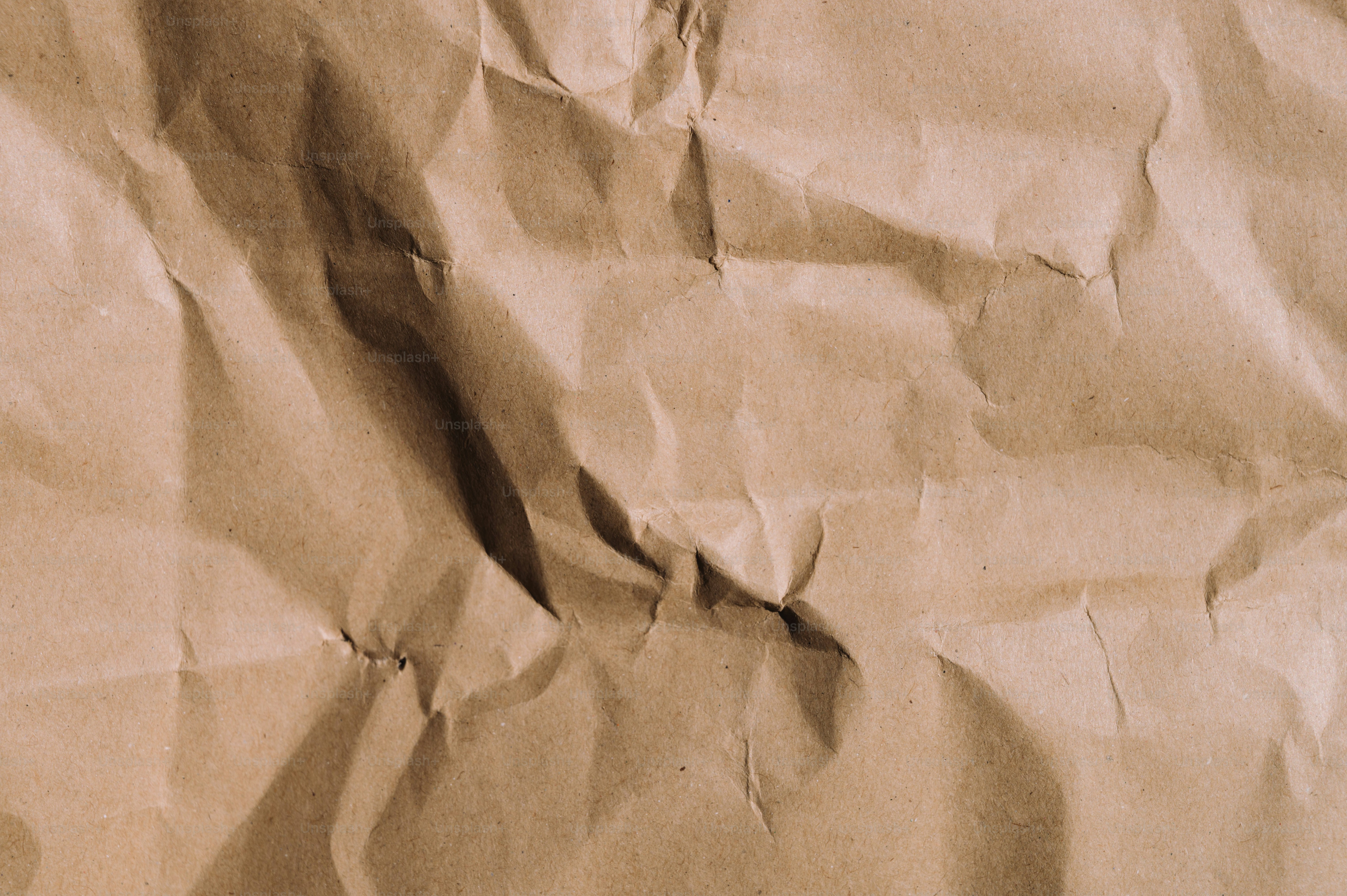 A piece of brown paper that has been wrinkled