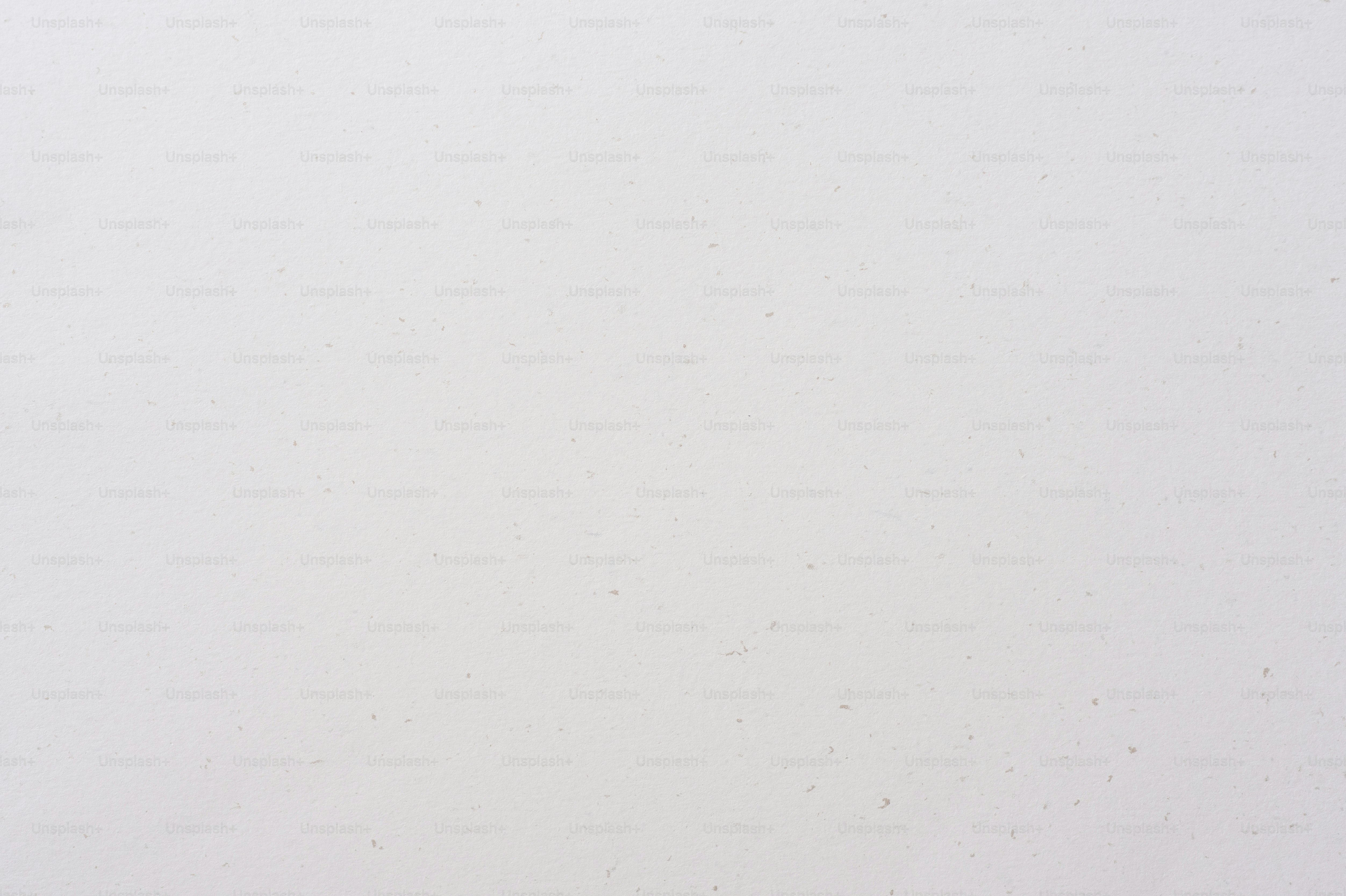 A man riding a snowboard down a snow covered slope