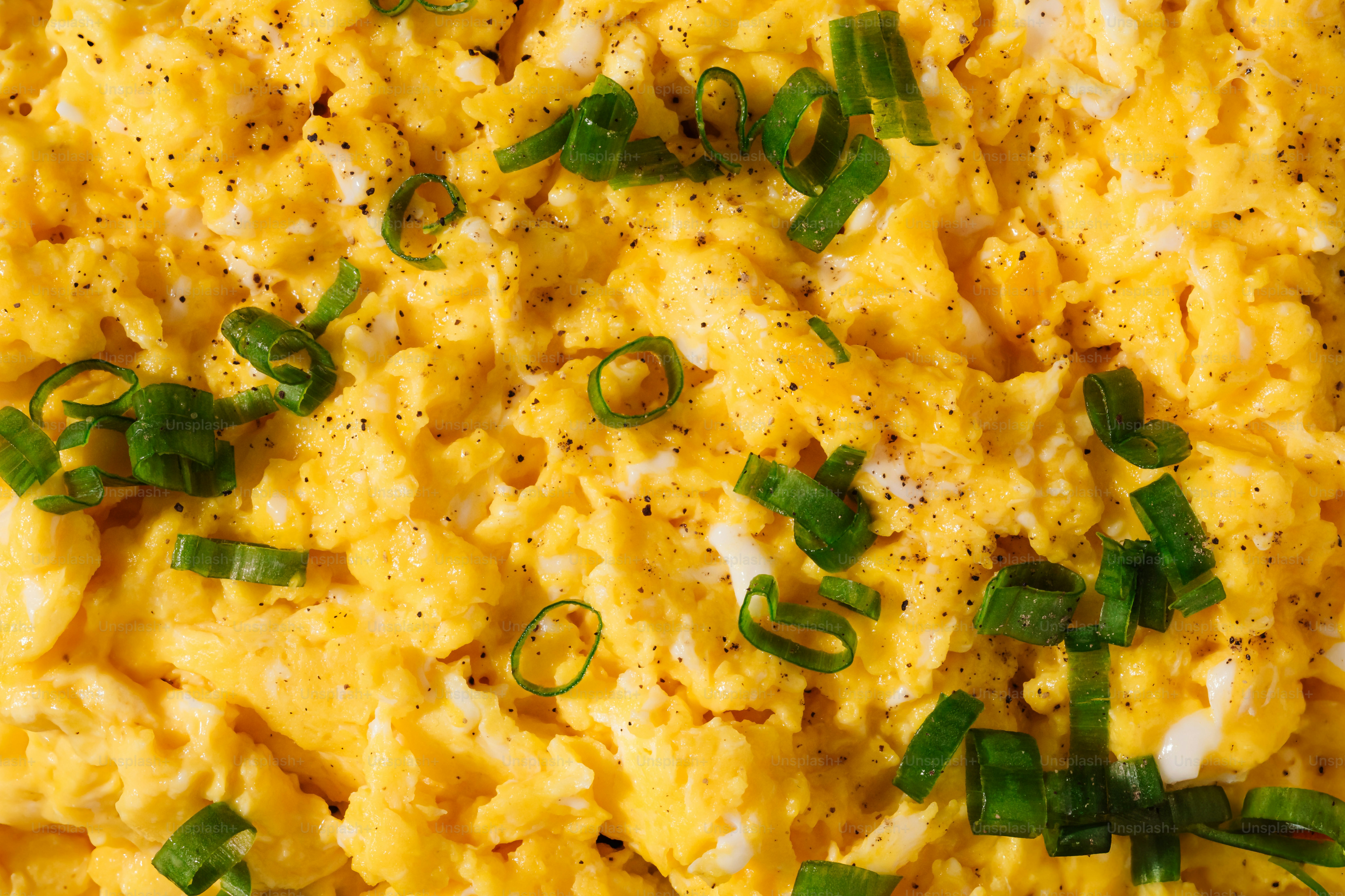 A plate of scrambled eggs with green onions photo – Scrambled egg Image ...