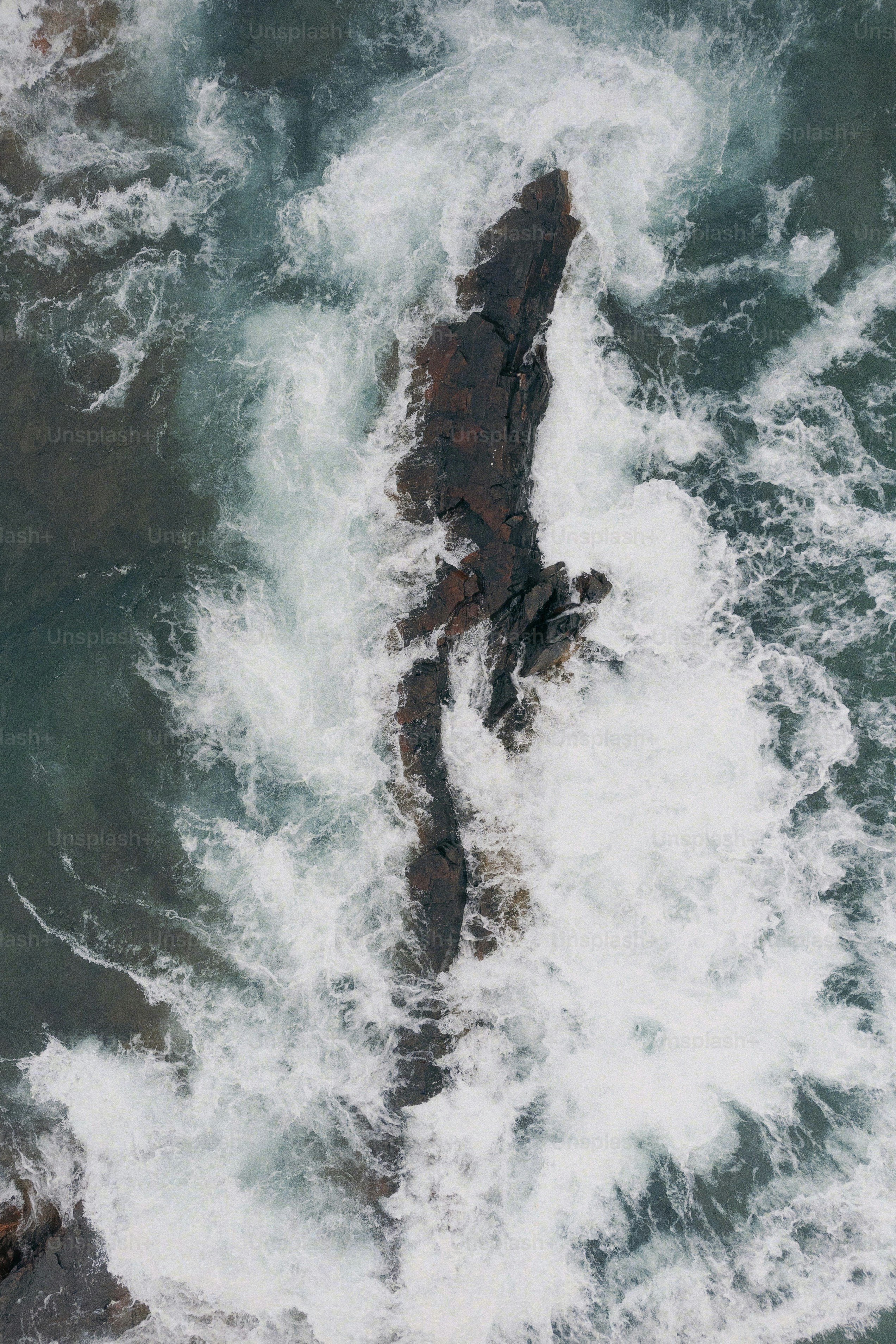 A large body of water surrounded by rocks