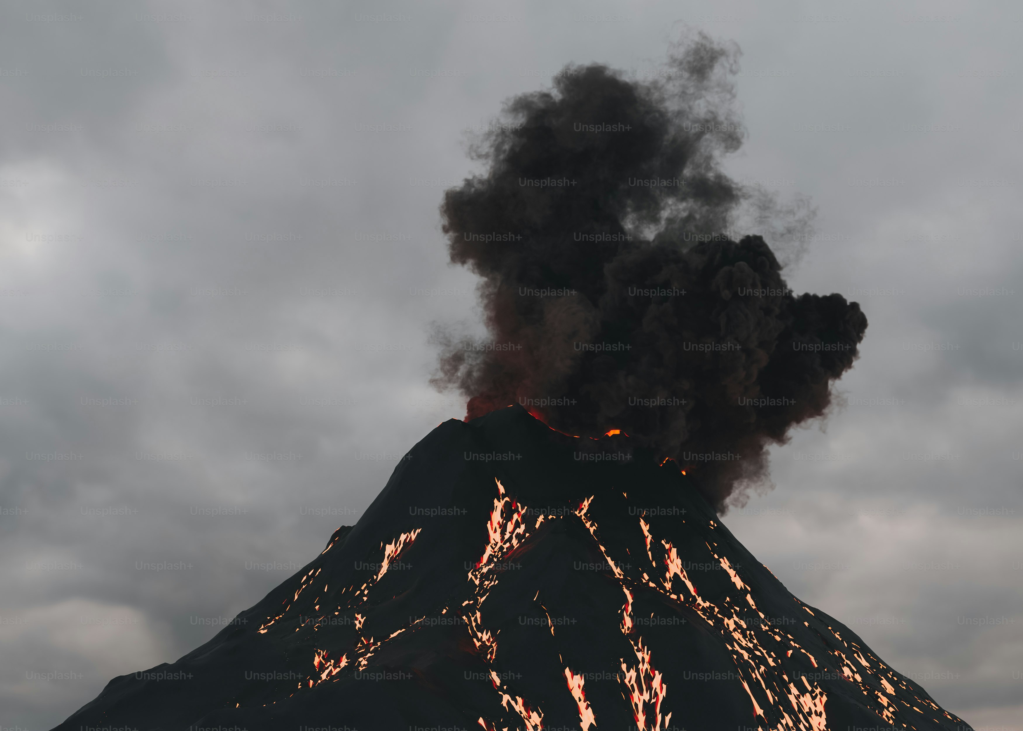 A volcano spewing black smoke on a cloudy day