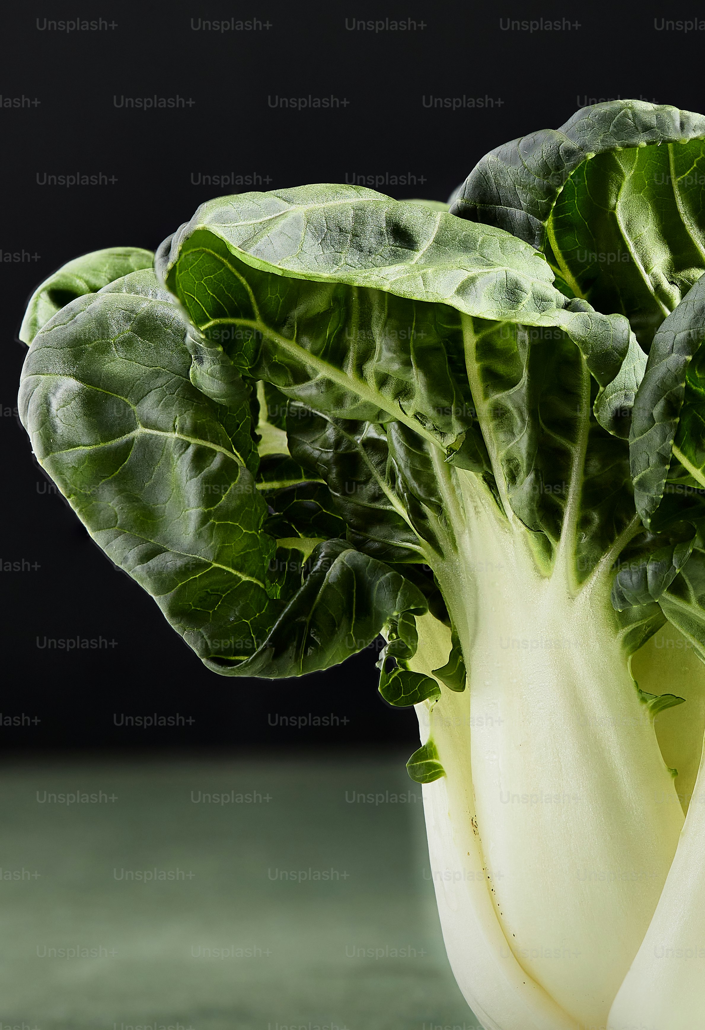 A close up of a leafy vegetable on a table