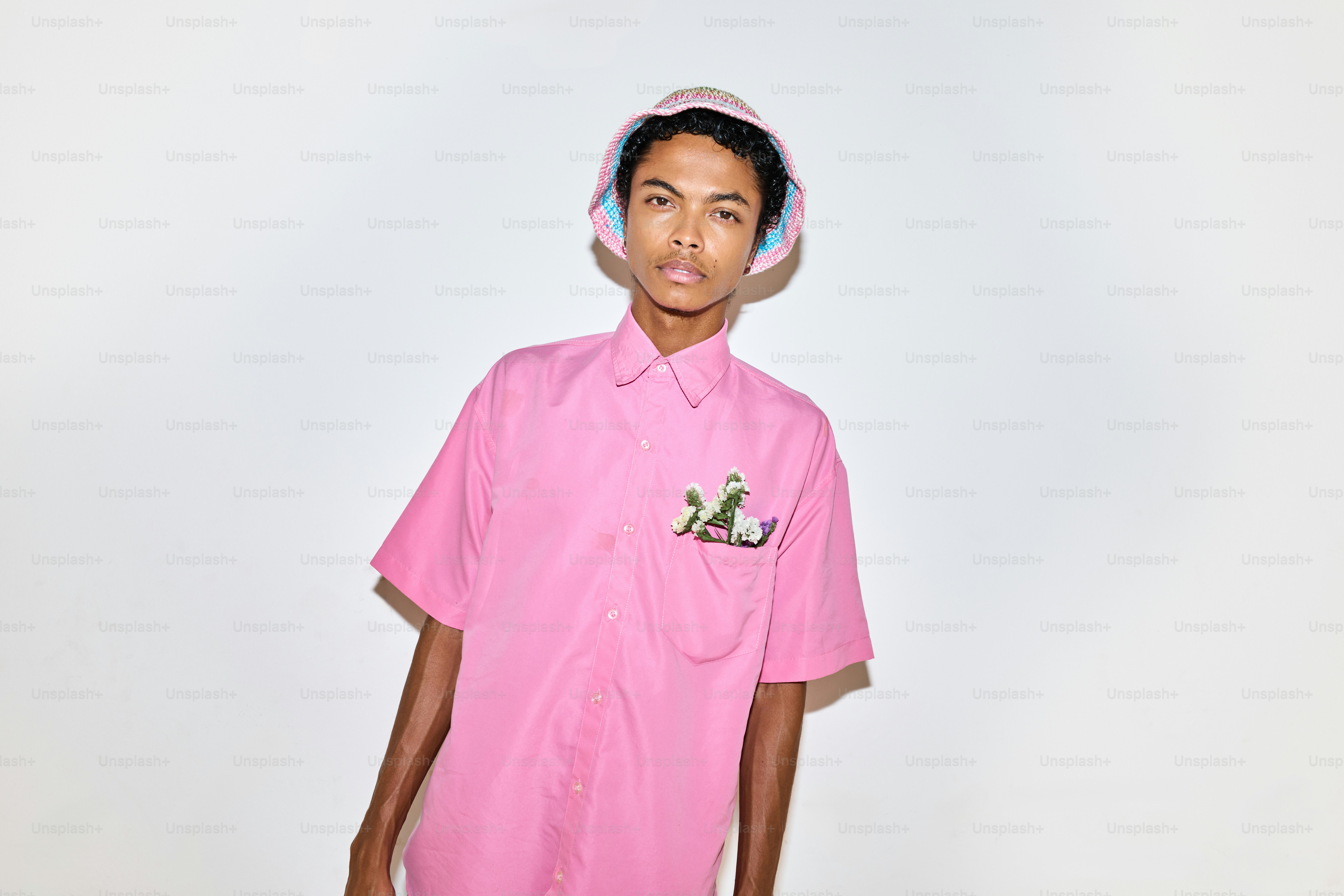 A man in a pink shirt and shorts