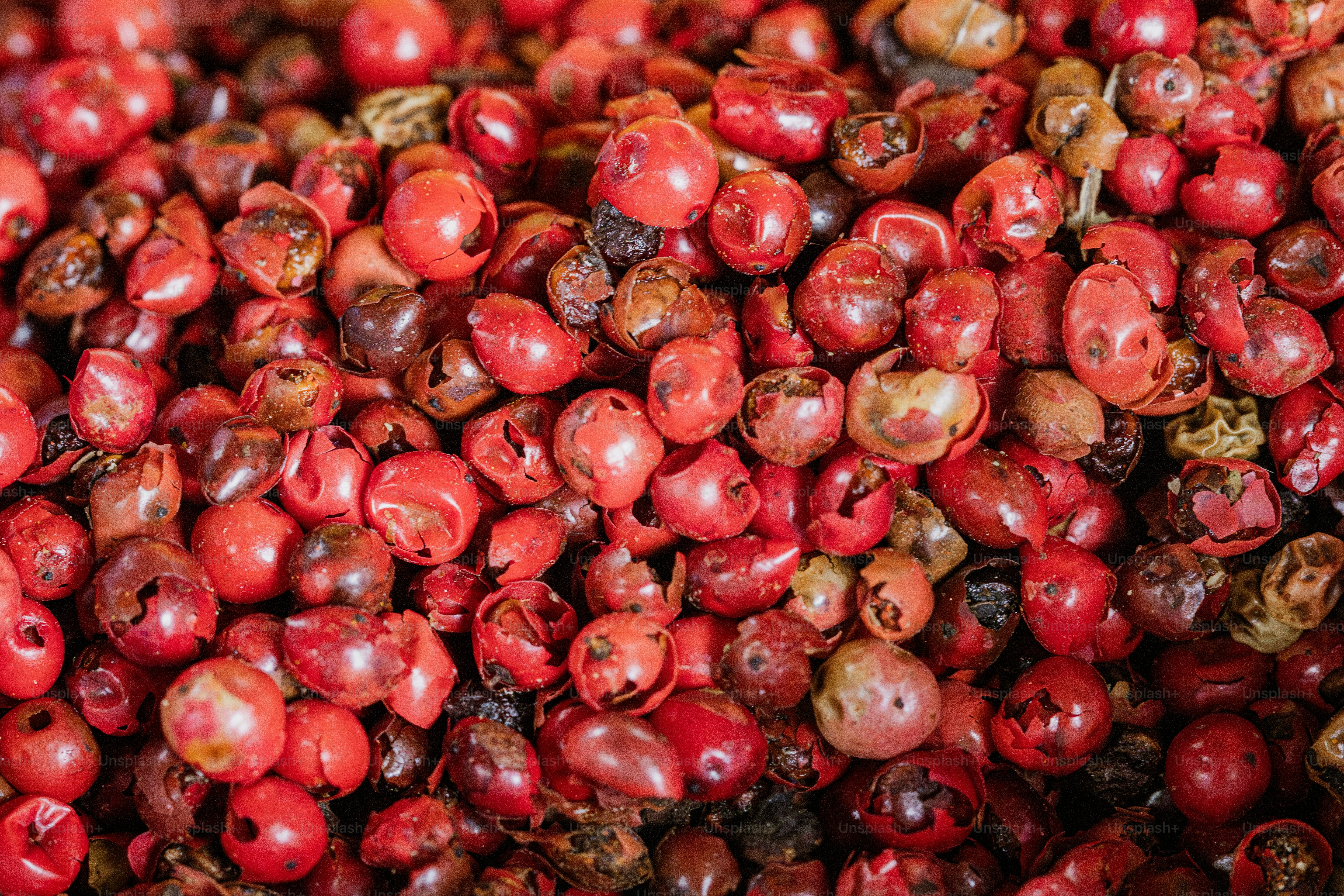 A pile of cranberries sitting next to each other