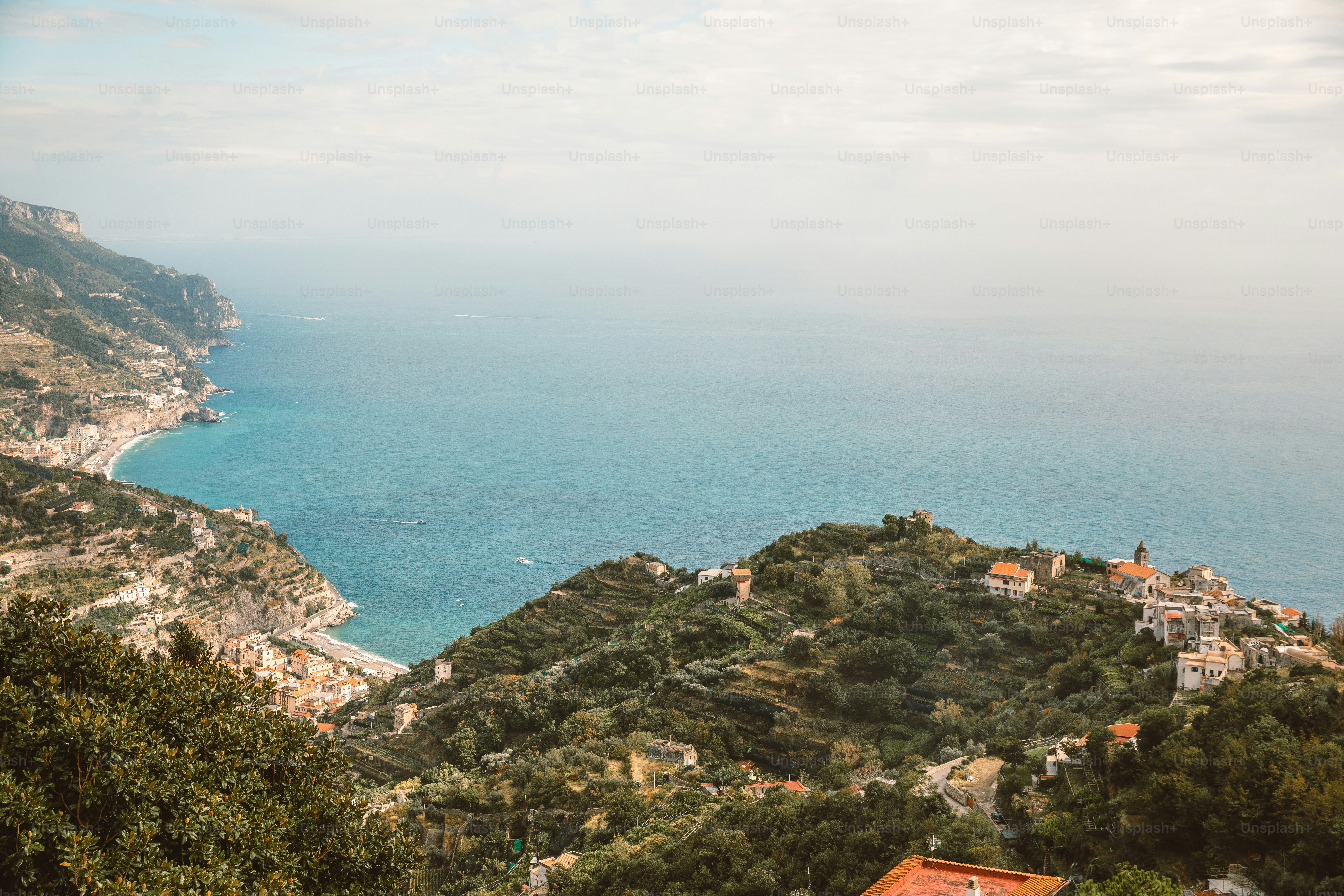 A scenic view of the ocean from a hill photo – Italy Image on Unsplash
